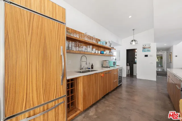 a kitchen with stainless steel appliances granite countertop a sink and cabinets
