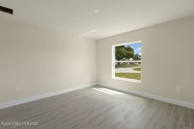 a kitchen with a sink a microwave a stove and refrigerator