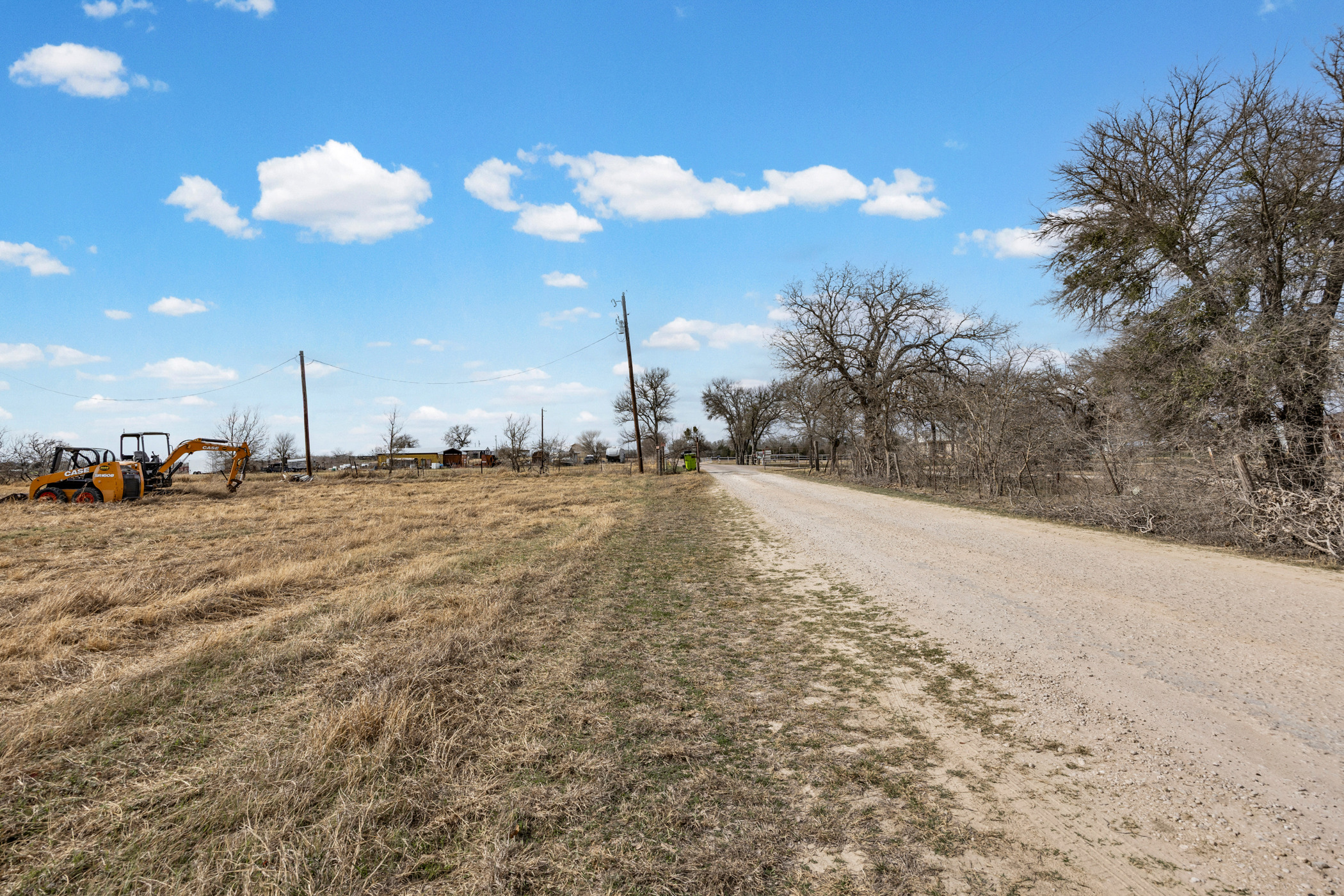 296 Blisard Road, Unit C Elgin, TX 78621 - Photo 12 of 12 View of dirt / gravel road featuring a view of rural / pastoral area