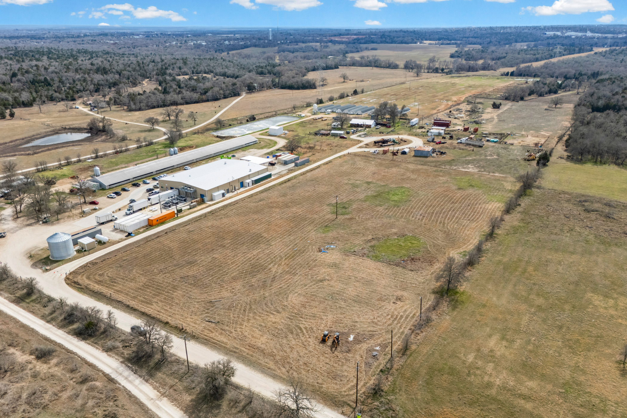 296 Blisard Road, Unit C Elgin, TX 78621 - Photo 2 of 12 View of rural area with rows of crops