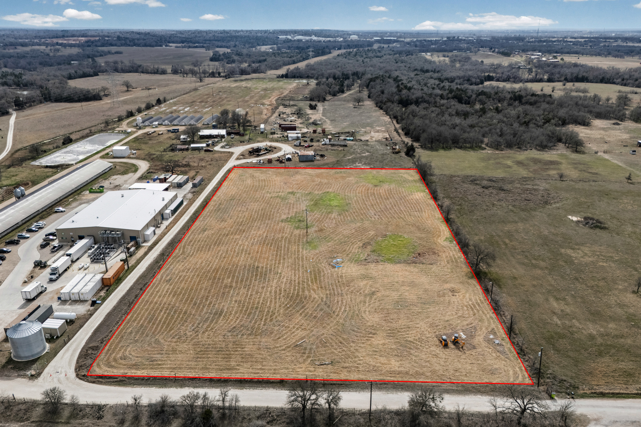 296 Blisard Road, Unit C Elgin, TX 78621 - Photo 3 of 12 Aerial view of sparsely populated area with large plots for crops and property parcel outlined