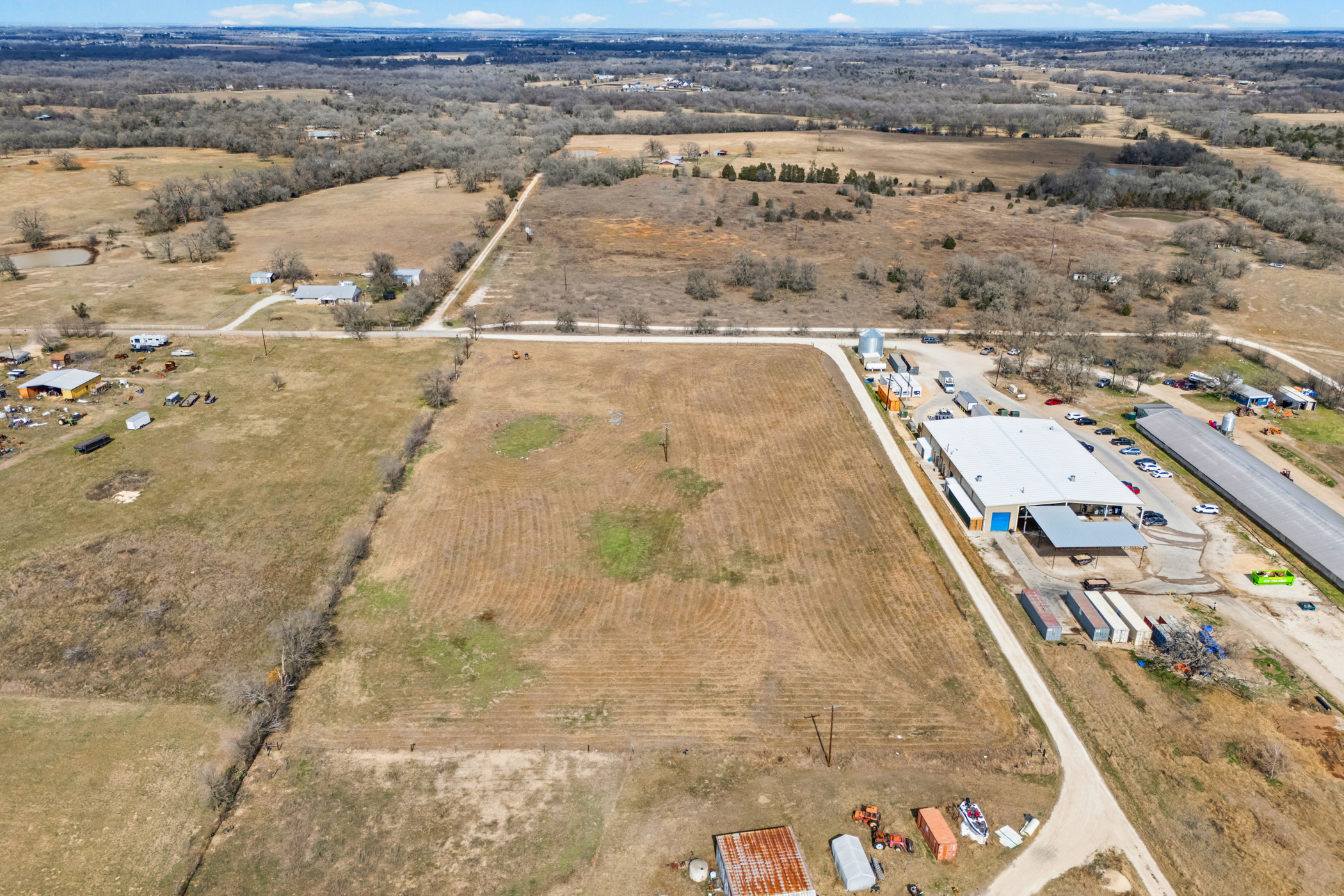 296 Blisard Road, Unit C Elgin, TX 78621 - Photo 5 of 12 Aerial view of property and surrounding area featuring rural landscape