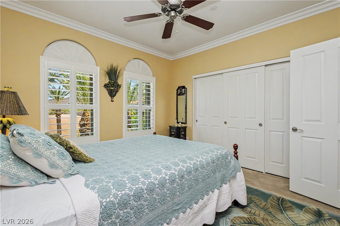 2555 Hampton Road, Unit 3308 Henderson, NV 89052 - Photo 34 of 65 Arch-top windows with louvered shutters invite abundant natural light into this charming bedroom.
