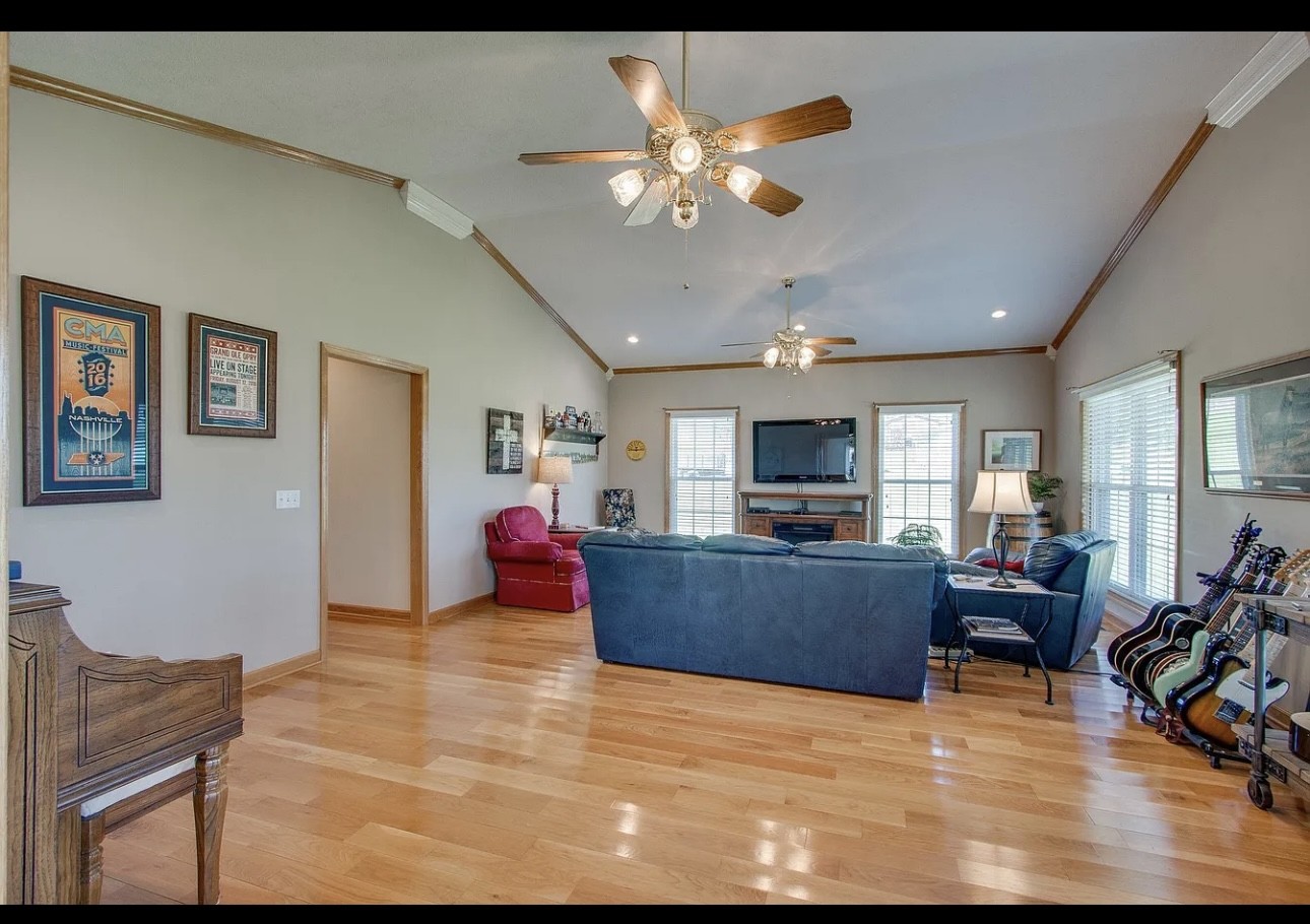 879 Tidwell Road Burns, TN 37029 - Photo 19 of 20 a living room with furniture and a flat screen tv