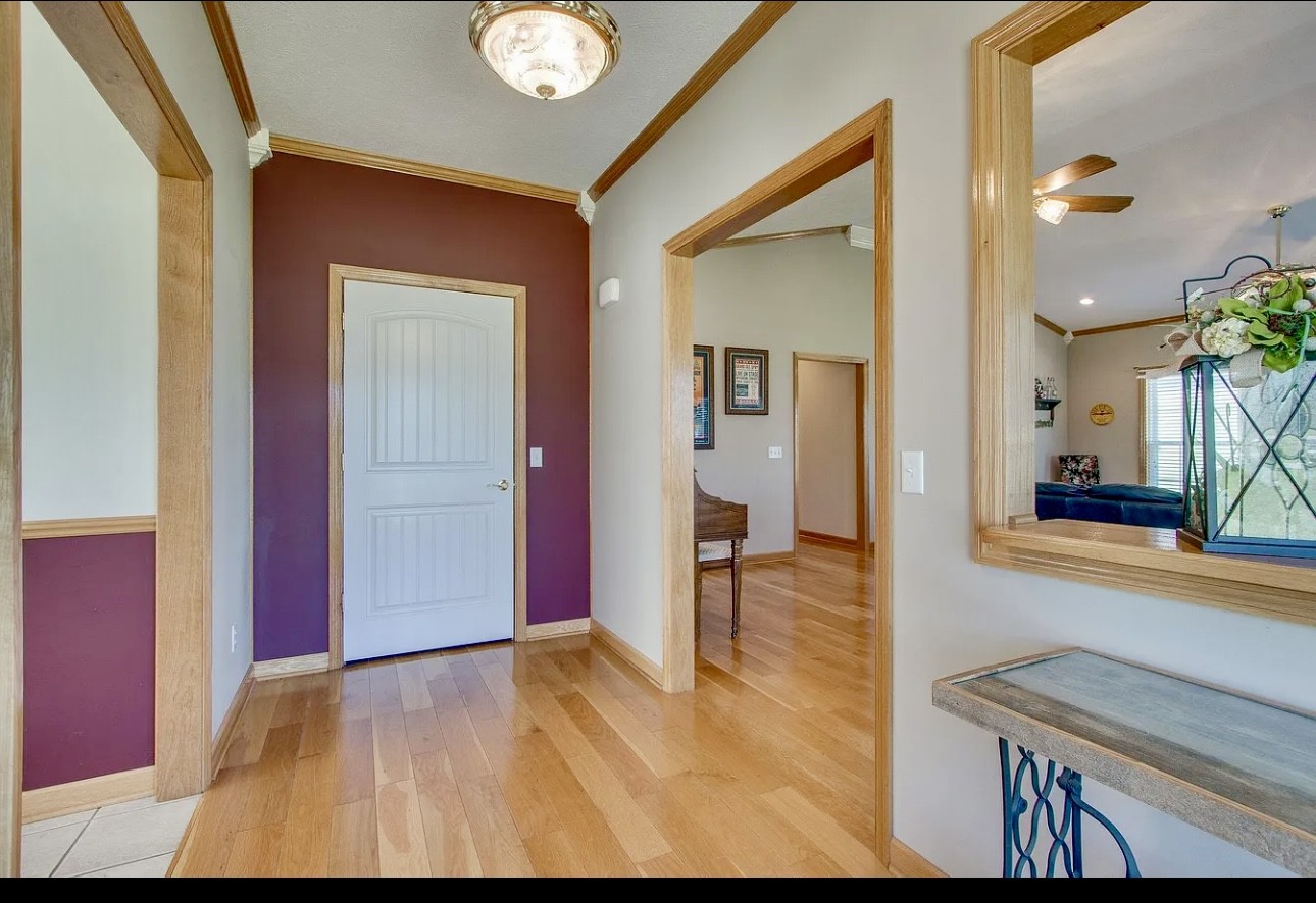 879 Tidwell Road Burns, TN 37029 - Photo 20 of 20 a view of a hallway view with wooden floor and living room