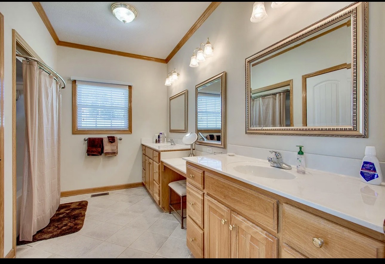 879 Tidwell Road Burns, TN 37029 - Photo 5 of 20 a bathroom with a sink and a mirror