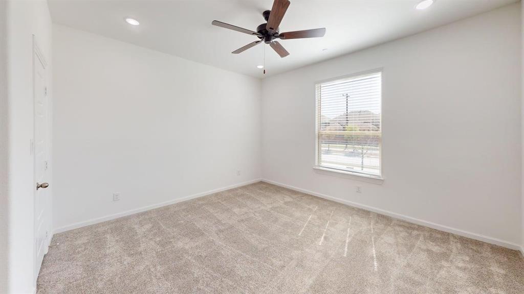 285 Buck Ridge Drive Frisco, TX 75068 - Photo 13 of 20 Spare room featuring light colored carpet, a ceiling fan, and recessed lighting
