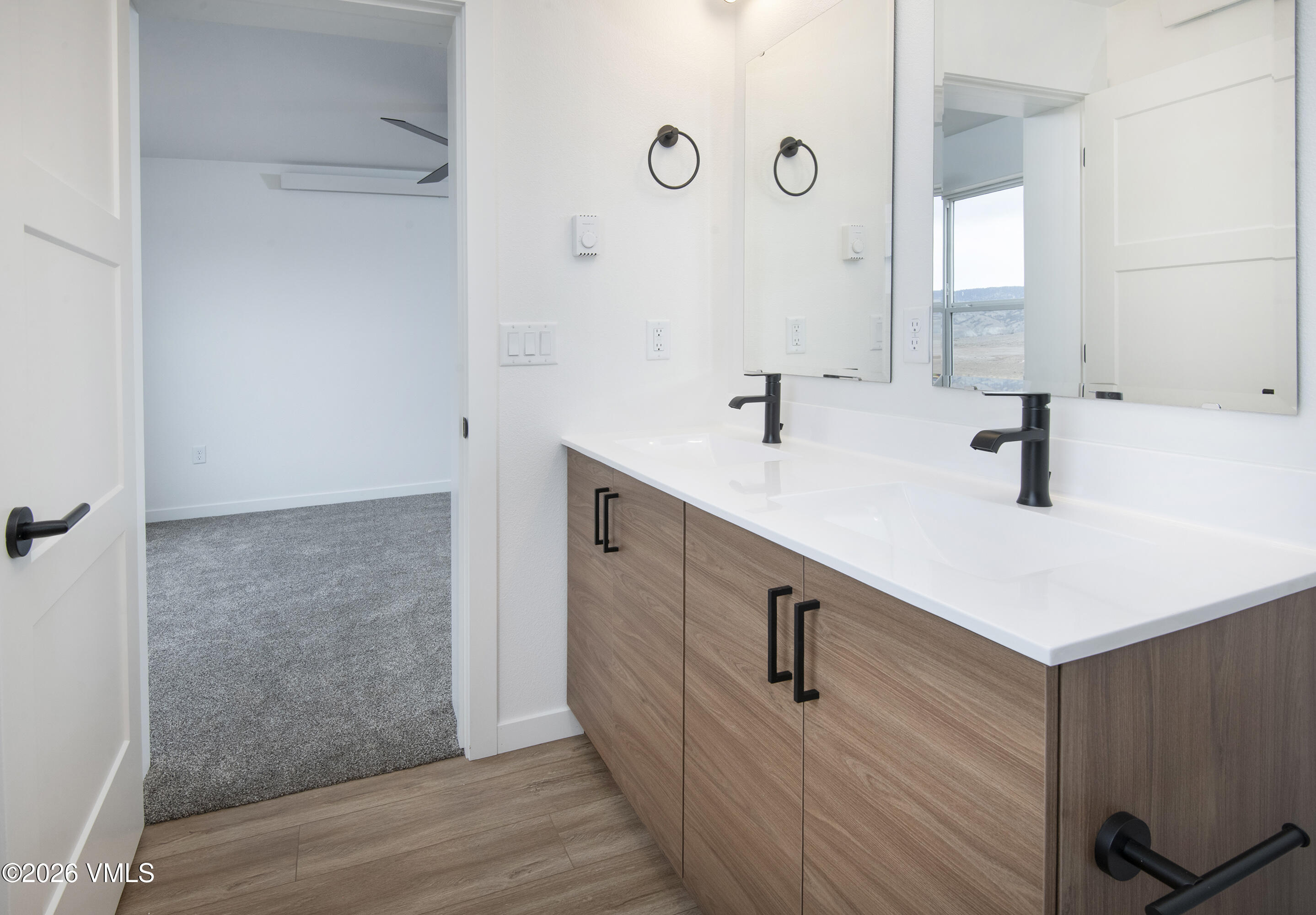 525 Blackhawk Road Gypsum, CO 81637 - Photo 7 of 23 a bathroom with a sink and a mirror