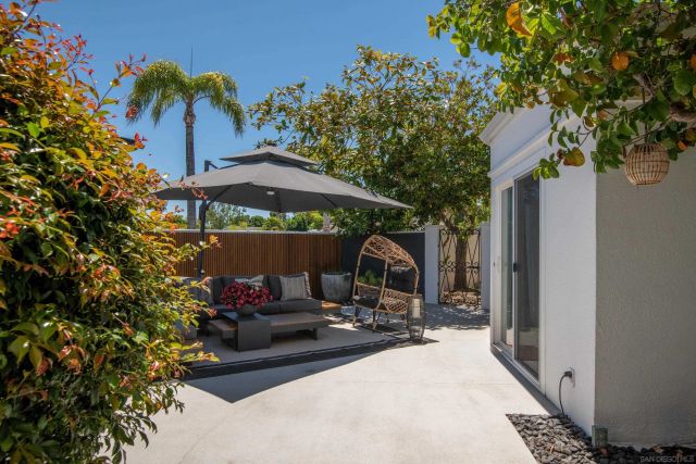 a view of a patio with furniture and a potted plants