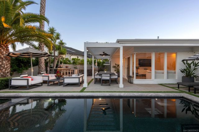 a kitchen with a sink and a stove top oven