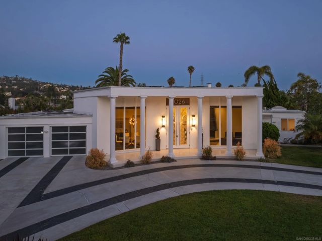 a front view of a house with a porch