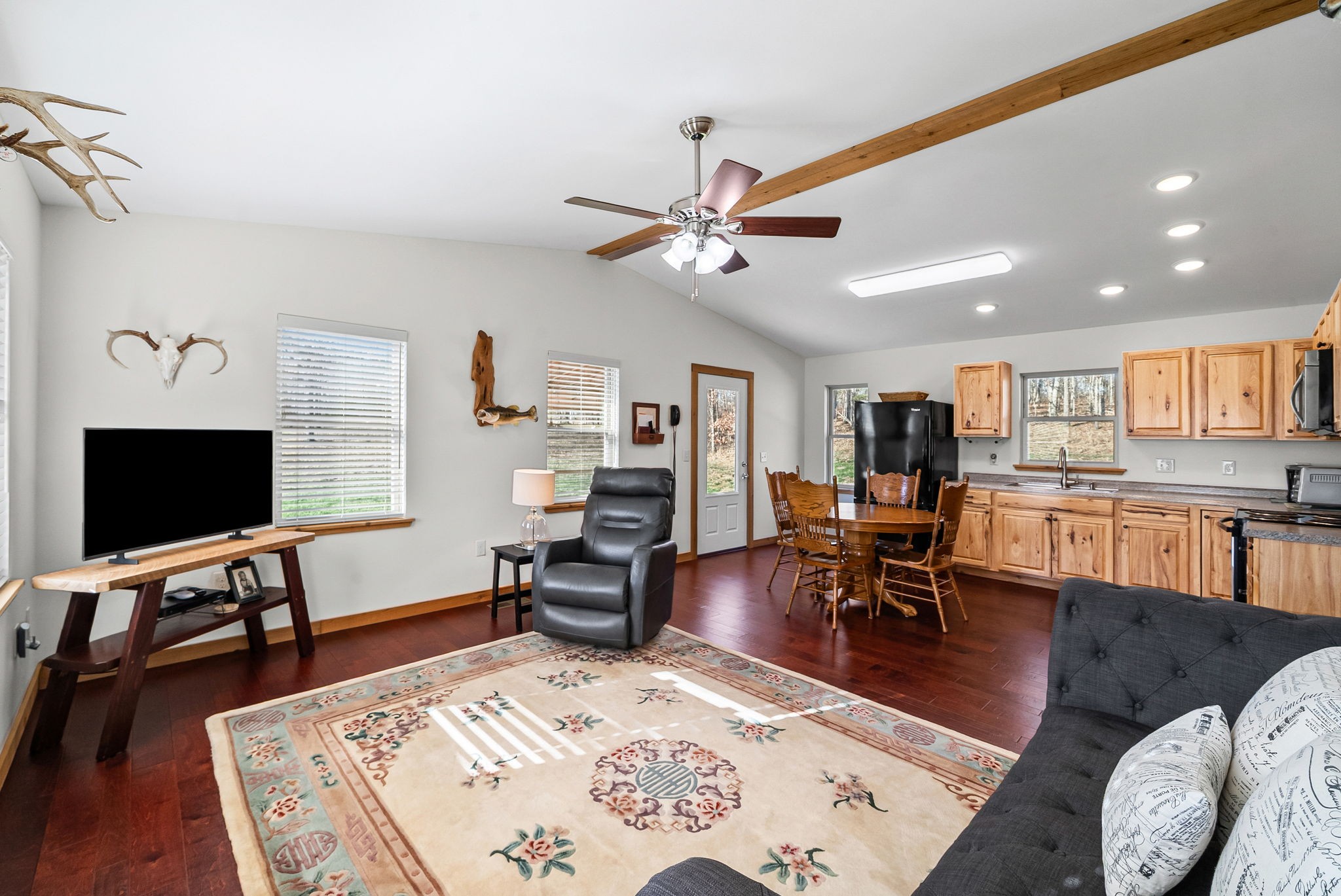 959 Herman Adams Road Cumberland City, TN 37050 - Photo 11 of 62 a living room with furniture and a flat screen tv