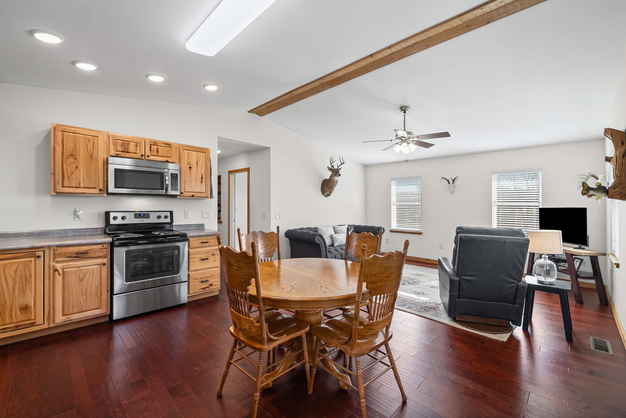 959 Herman Adams Road Cumberland City, TN 37050 - Photo 14 of 62 a view of kitchen with granite countertop microwave stove dining table and chairs