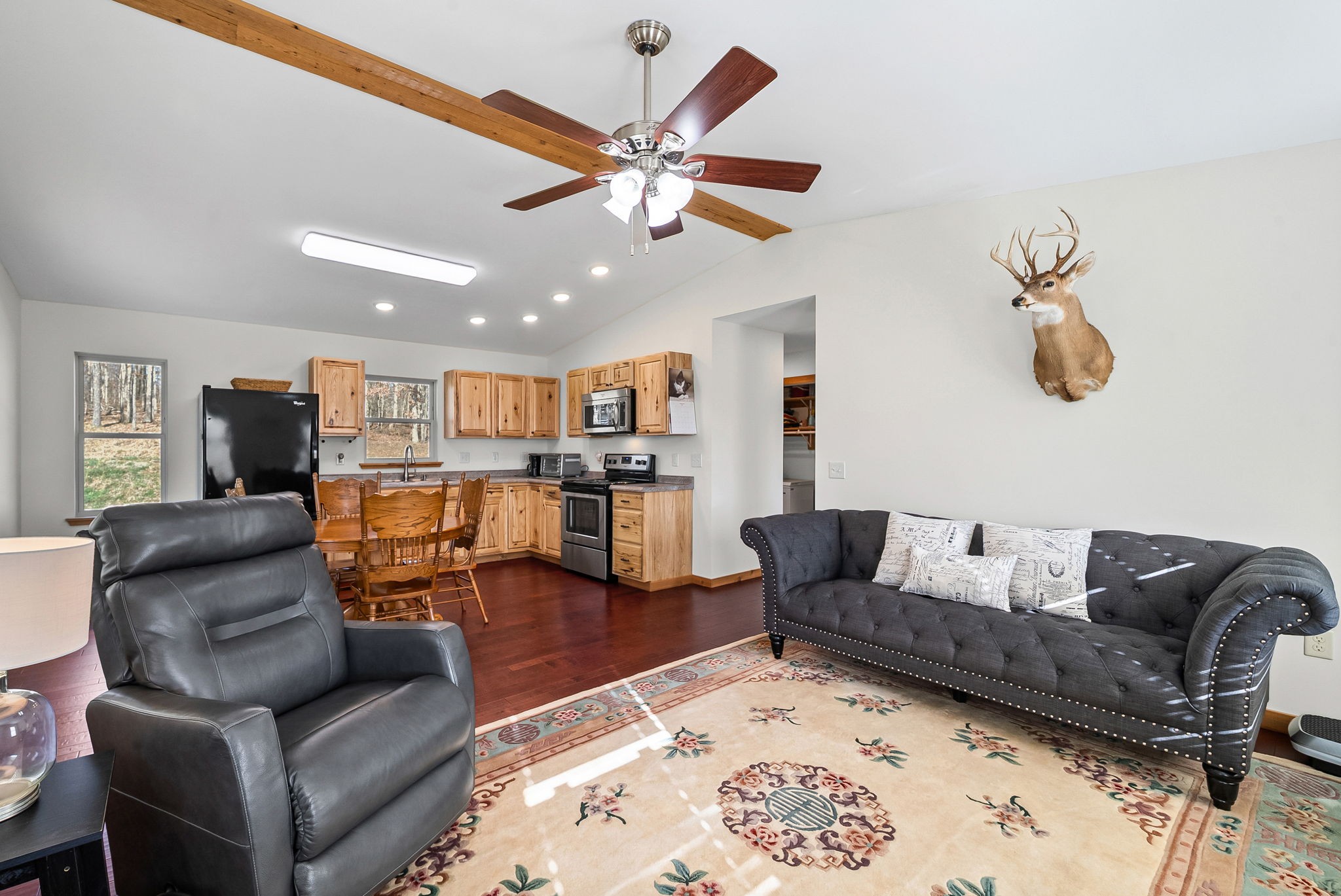 959 Herman Adams Road Cumberland City, TN 37050 - Photo 17 of 62 a living room with furniture kitchen view and a chandelier