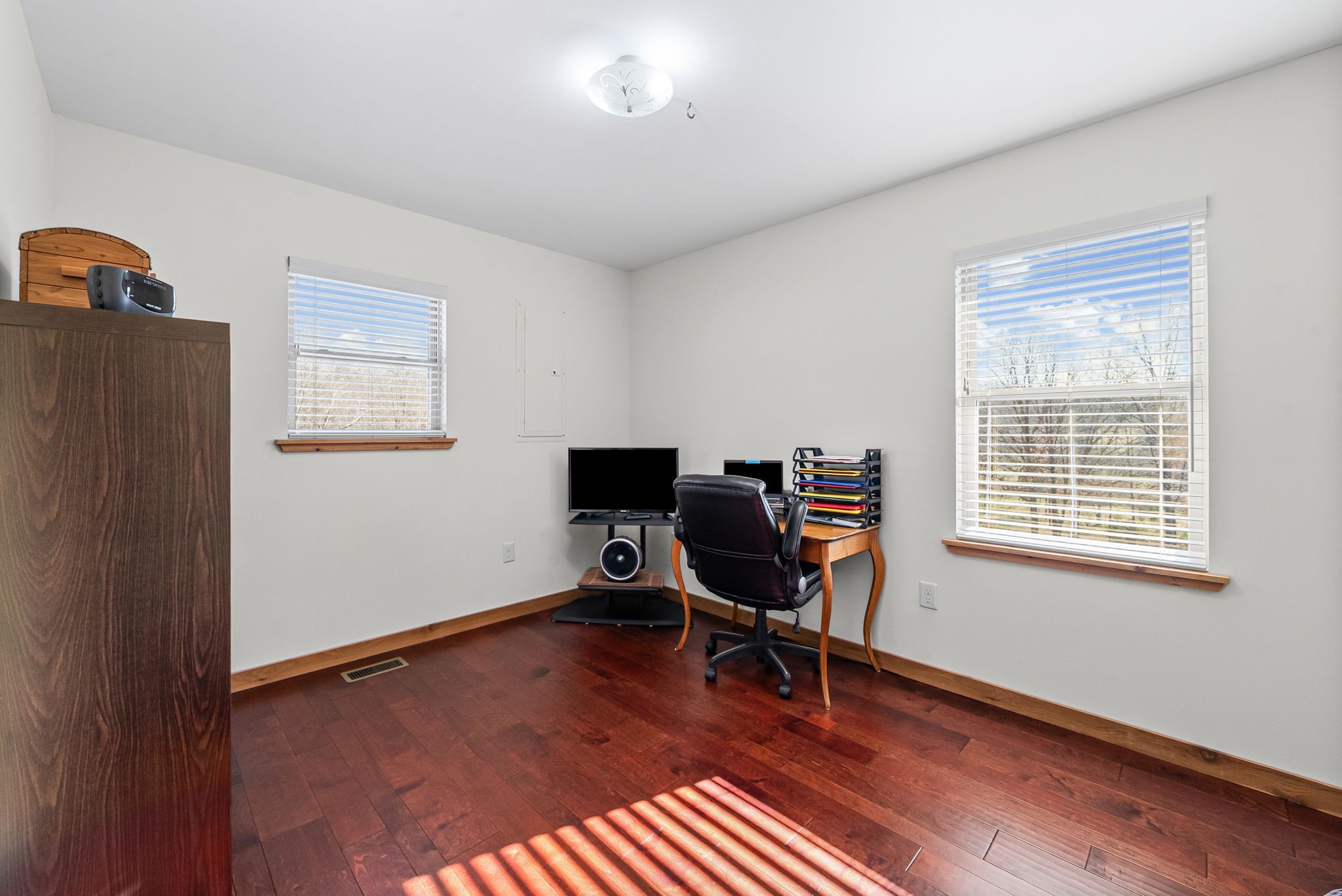 959 Herman Adams Road Cumberland City, TN 37050 - Photo 21 of 62 a view of a workspace with furniture and a window