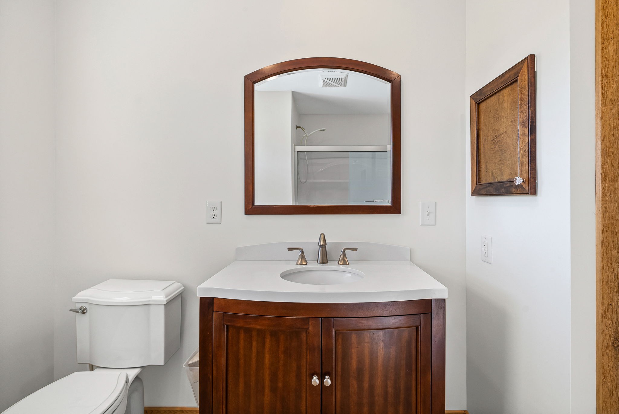 959 Herman Adams Road Cumberland City, TN 37050 - Photo 25 of 62 a bathroom with a toilet sink and mirror