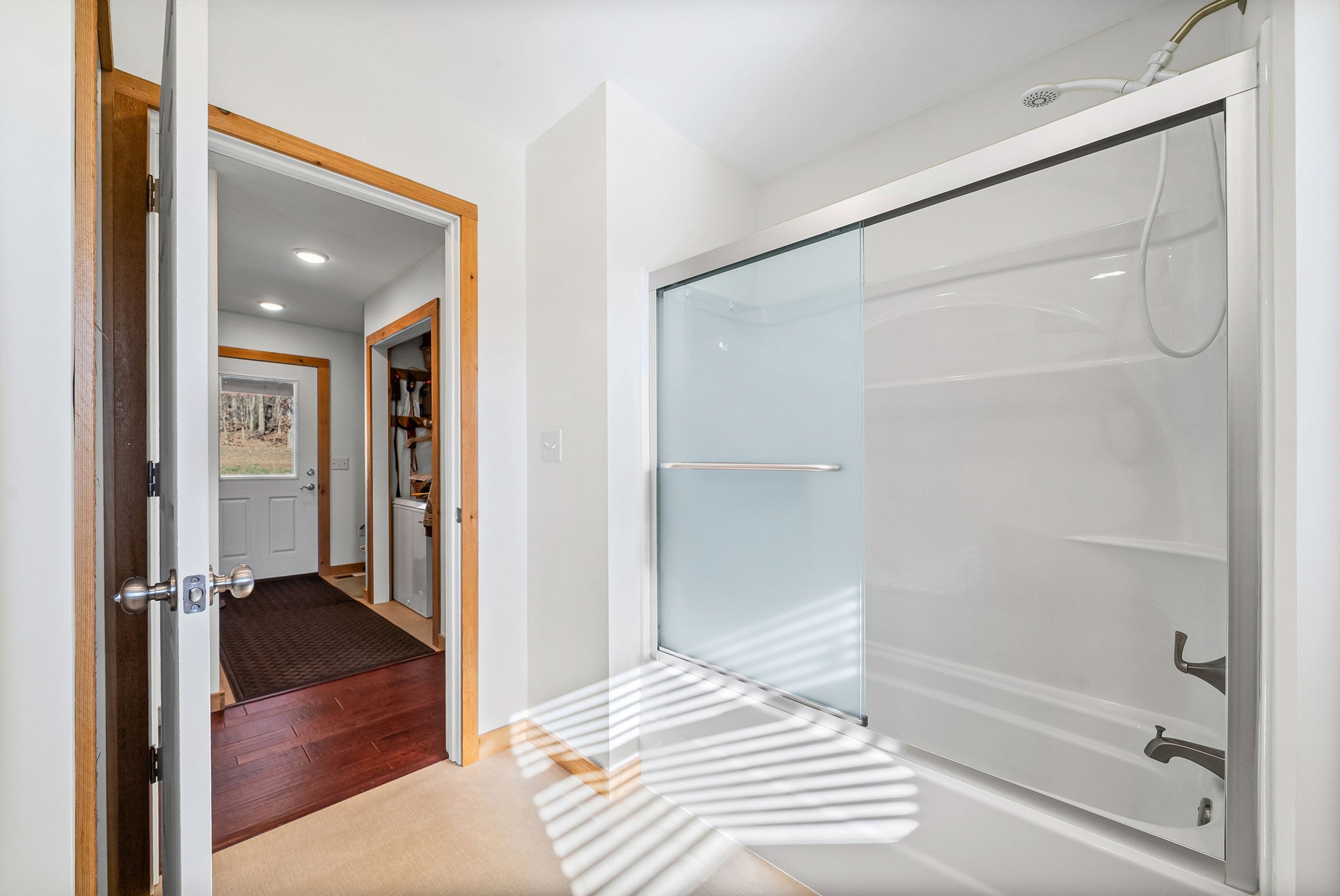 959 Herman Adams Road Cumberland City, TN 37050 - Photo 26 of 62 a bathroom with a bathtub and a shower