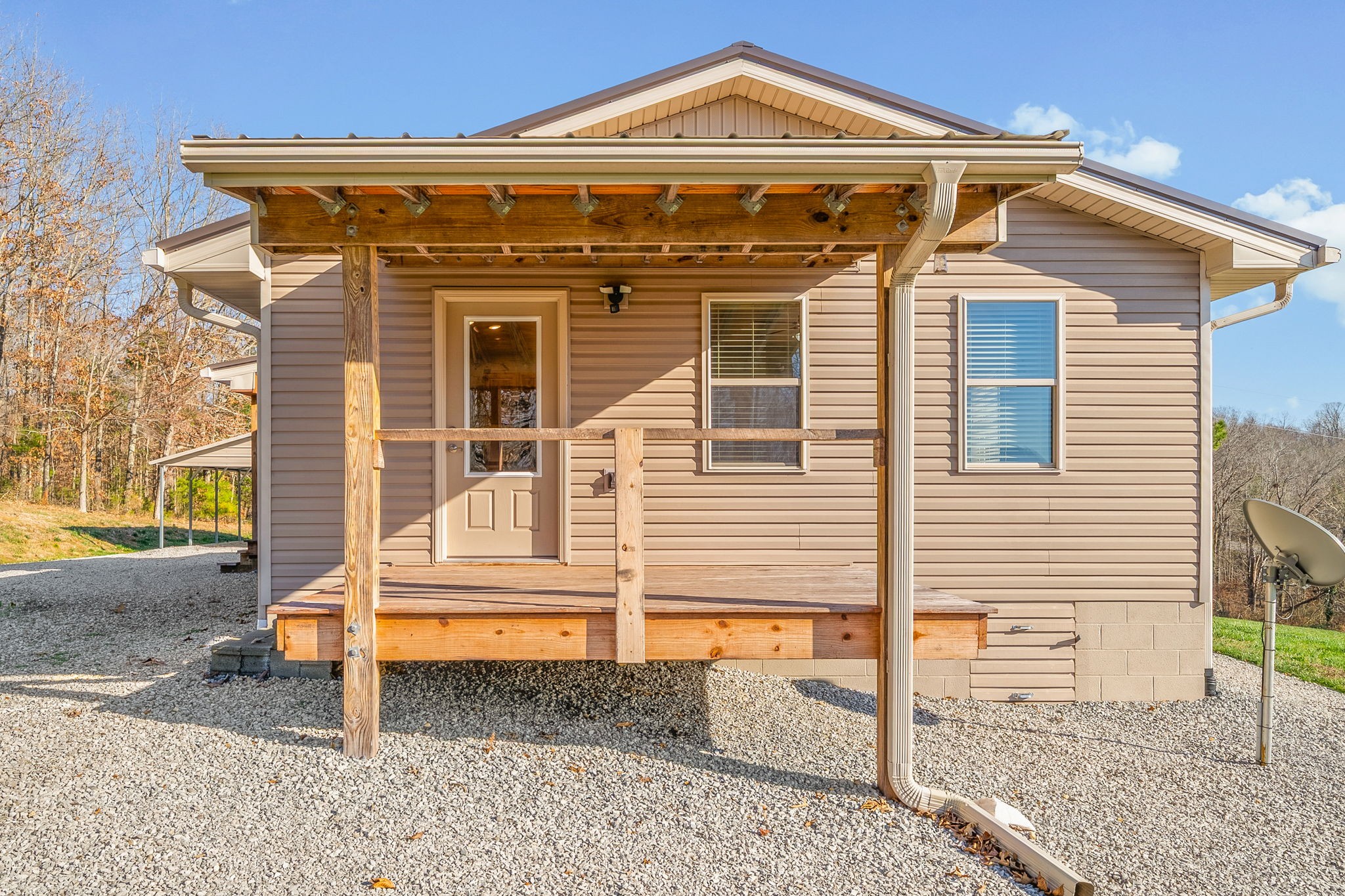 959 Herman Adams Road Cumberland City, TN 37050 - Photo 29 of 62 a front view of a house with a porch