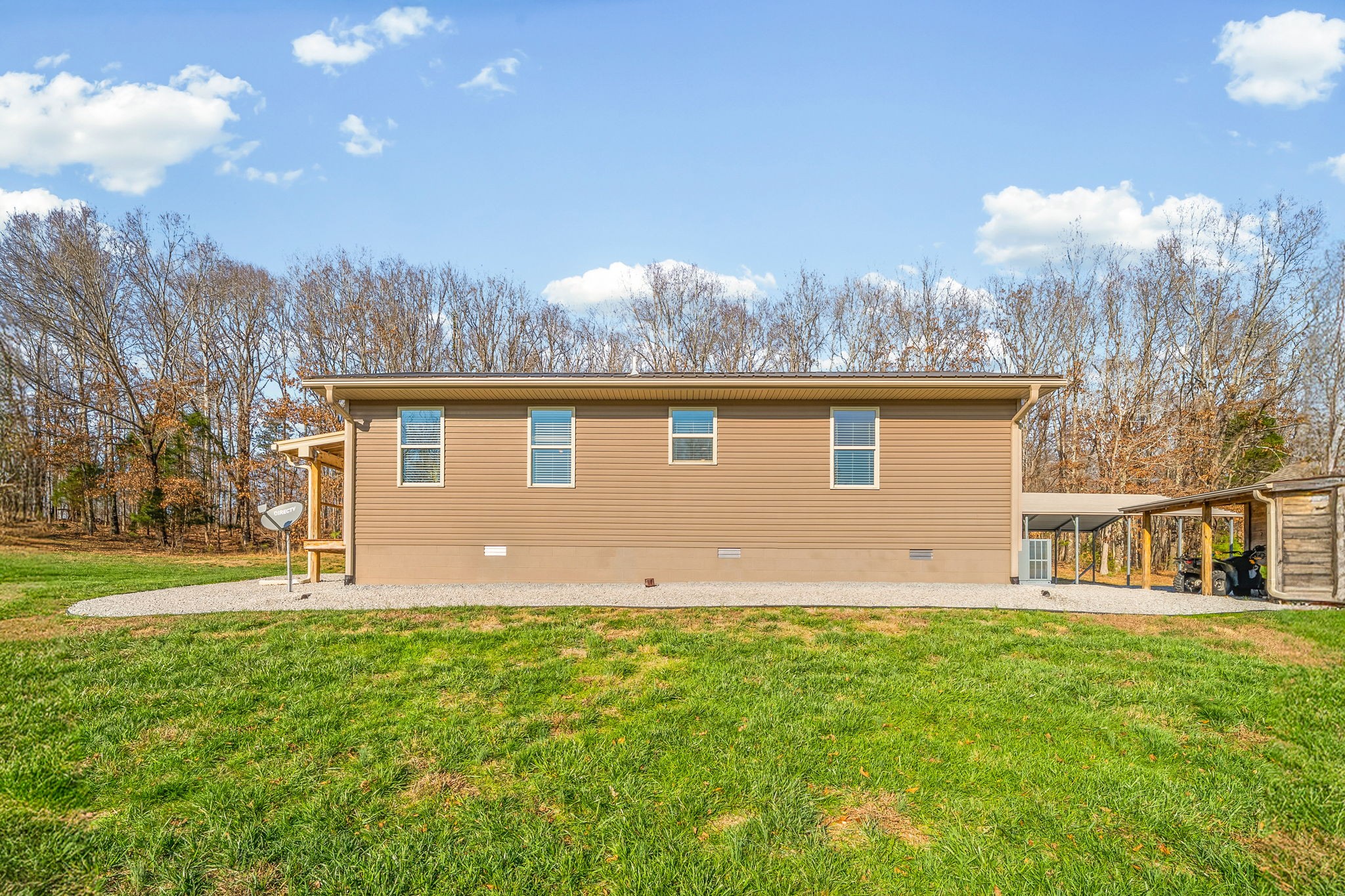 959 Herman Adams Road Cumberland City, TN 37050 - Photo 33 of 62 a backyard of a house with lots of green space