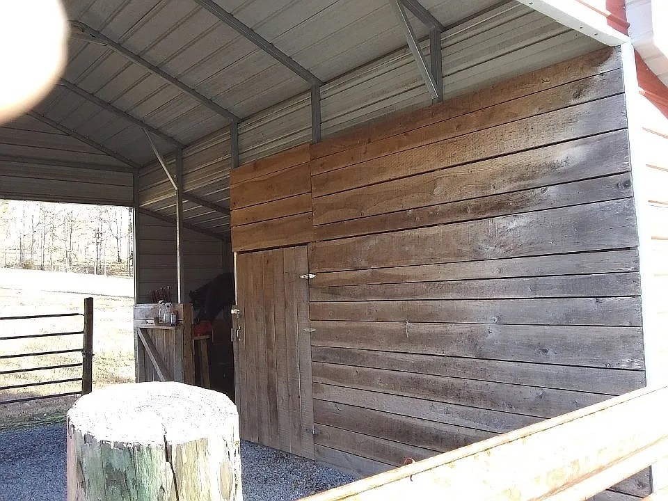 959 Herman Adams Road Cumberland City, TN 37050 - Photo 49 of 62 a bathroom with a toilet and bathtub