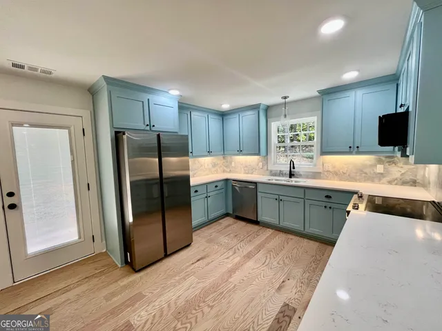 a view of kitchen with microwave and furniture