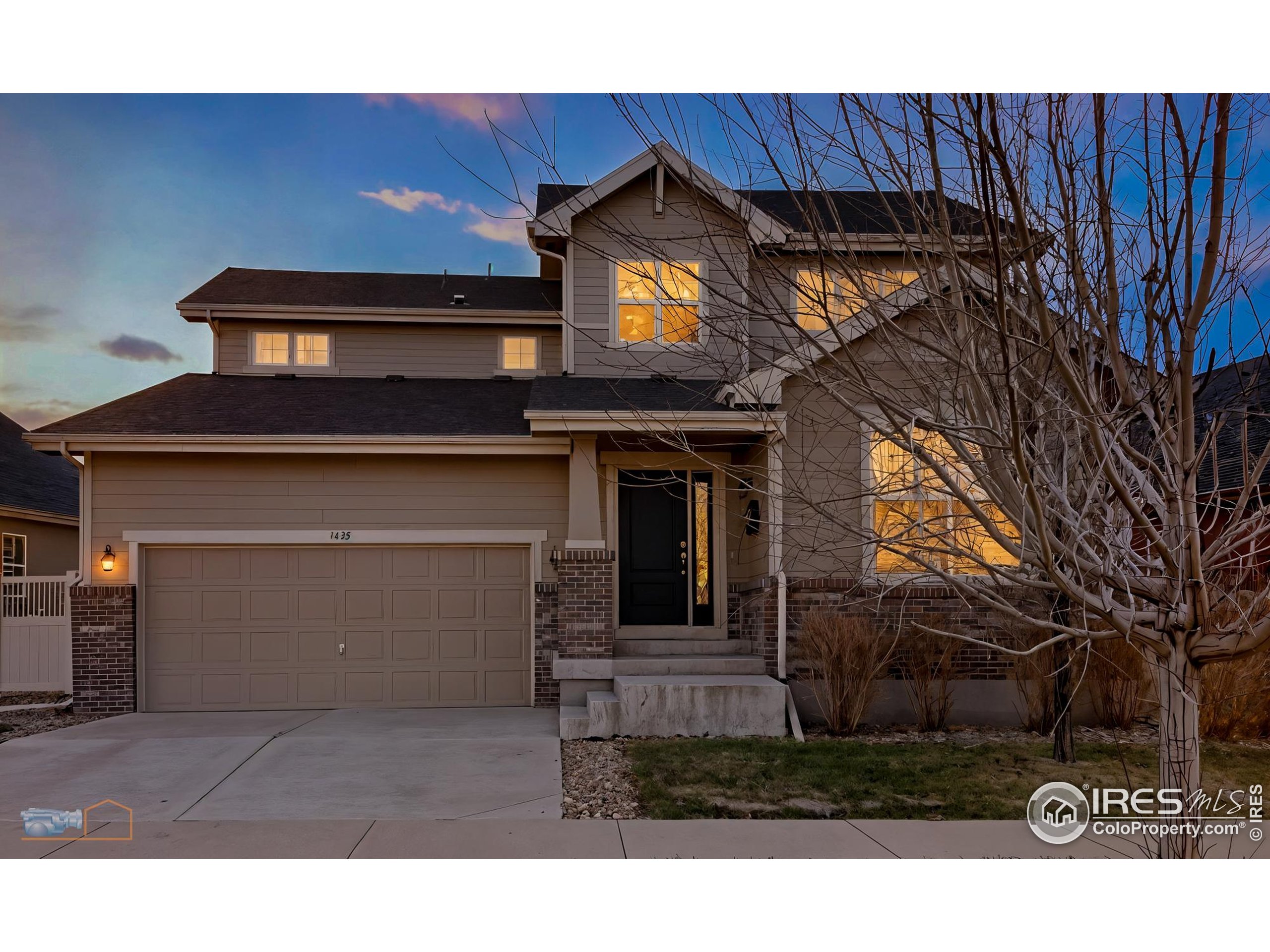 1435 Rustic Drive Longmont, CO 80504 - Photo 1 of 45 a view of a house with a yard