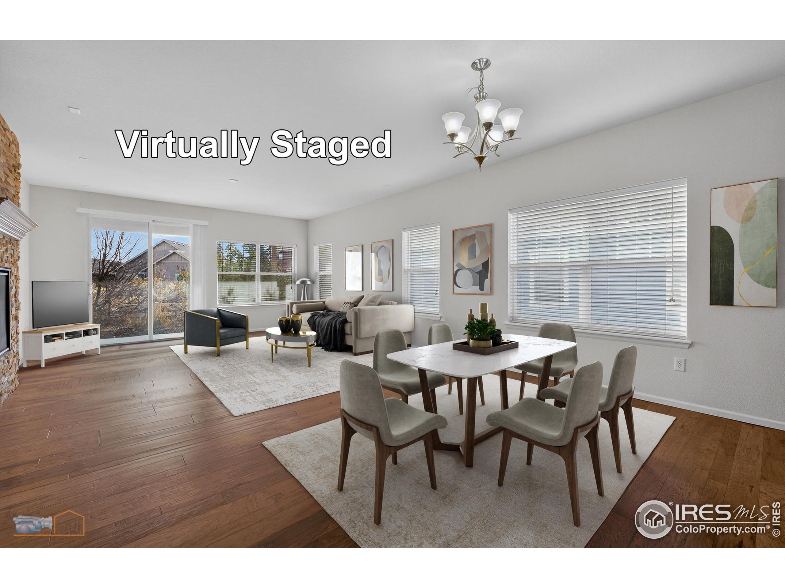 1435 Rustic Drive Longmont, CO 80504 - Photo 11 of 45 a view of a dining room with furniture and wooden floor