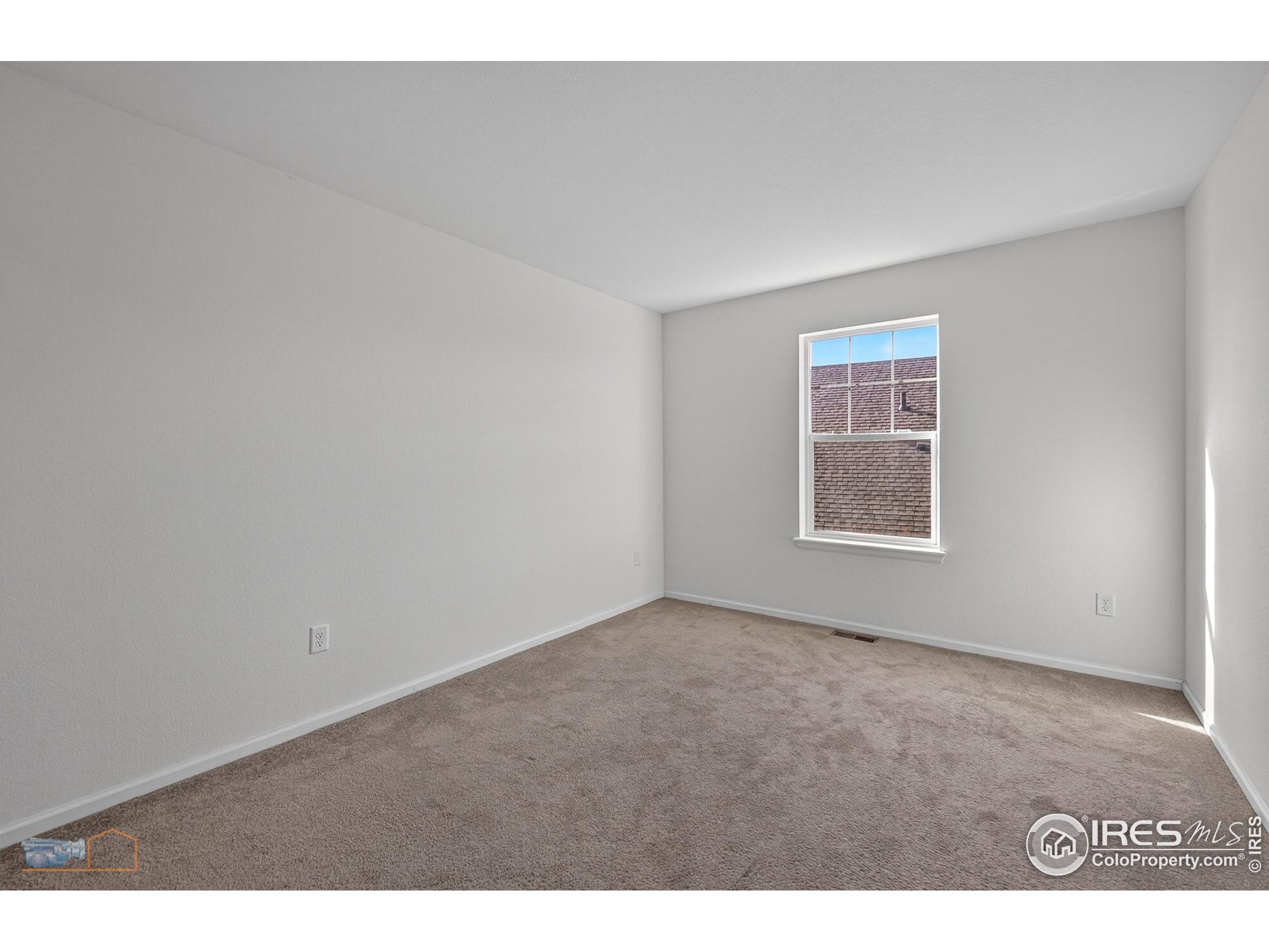1435 Rustic Drive Longmont, CO 80504 - Photo 28 of 45 a view of an empty room with a window