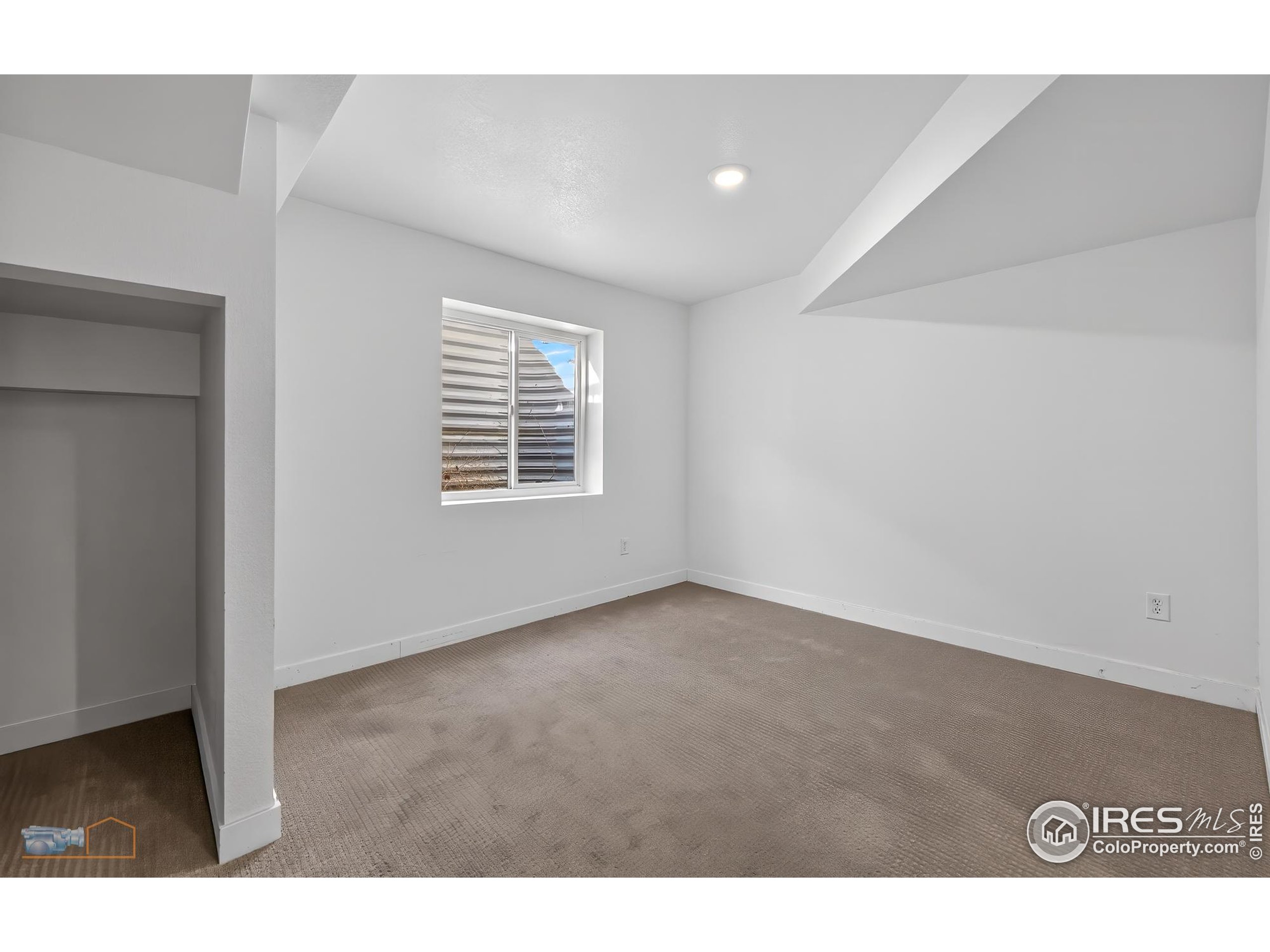 1435 Rustic Drive Longmont, CO 80504 - Photo 33 of 45 a view of an empty room with a window