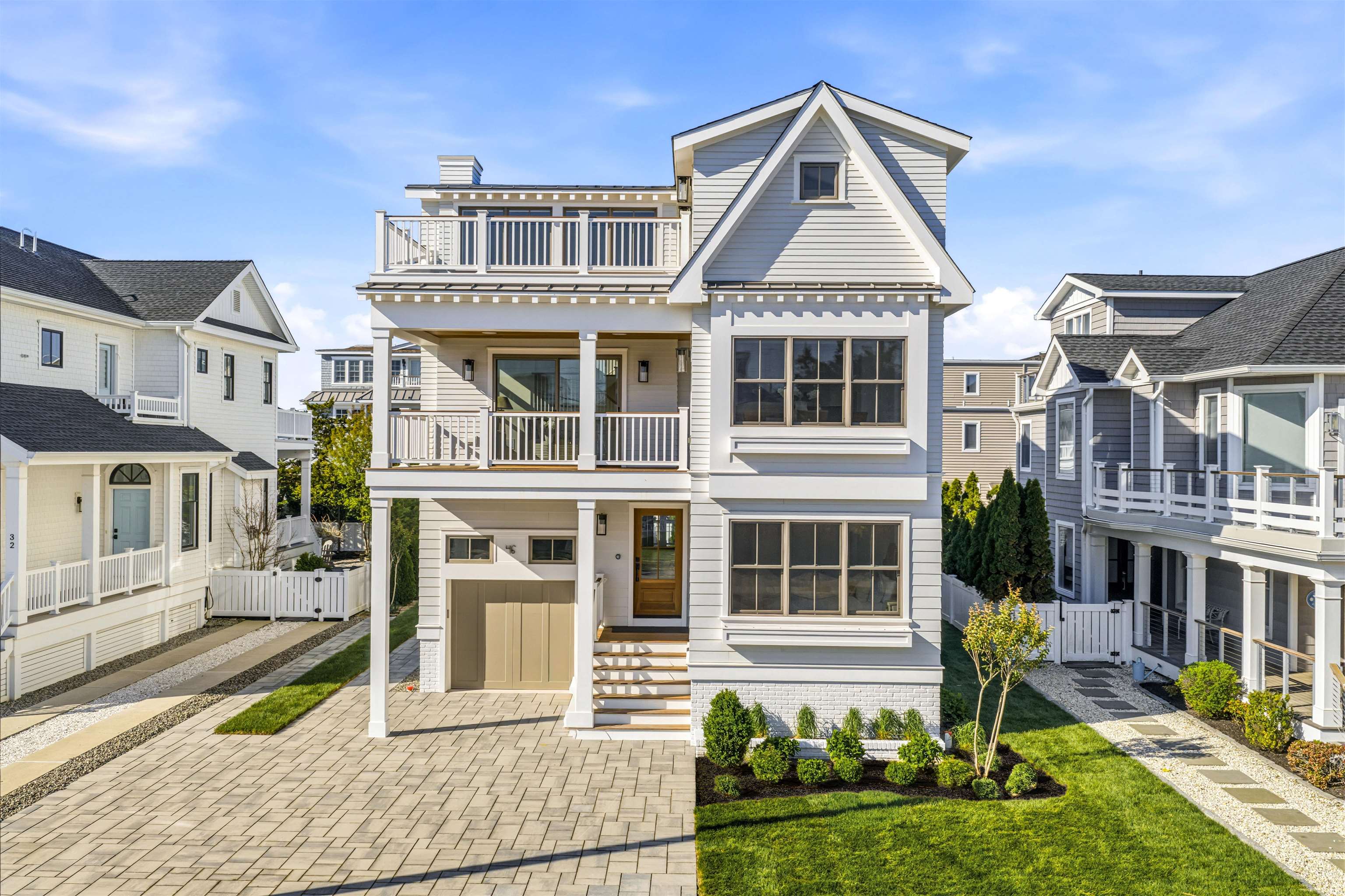 46 West 31st Avalon, NJ 08202 - Photo 1 of 50 a front view of a house with a yard