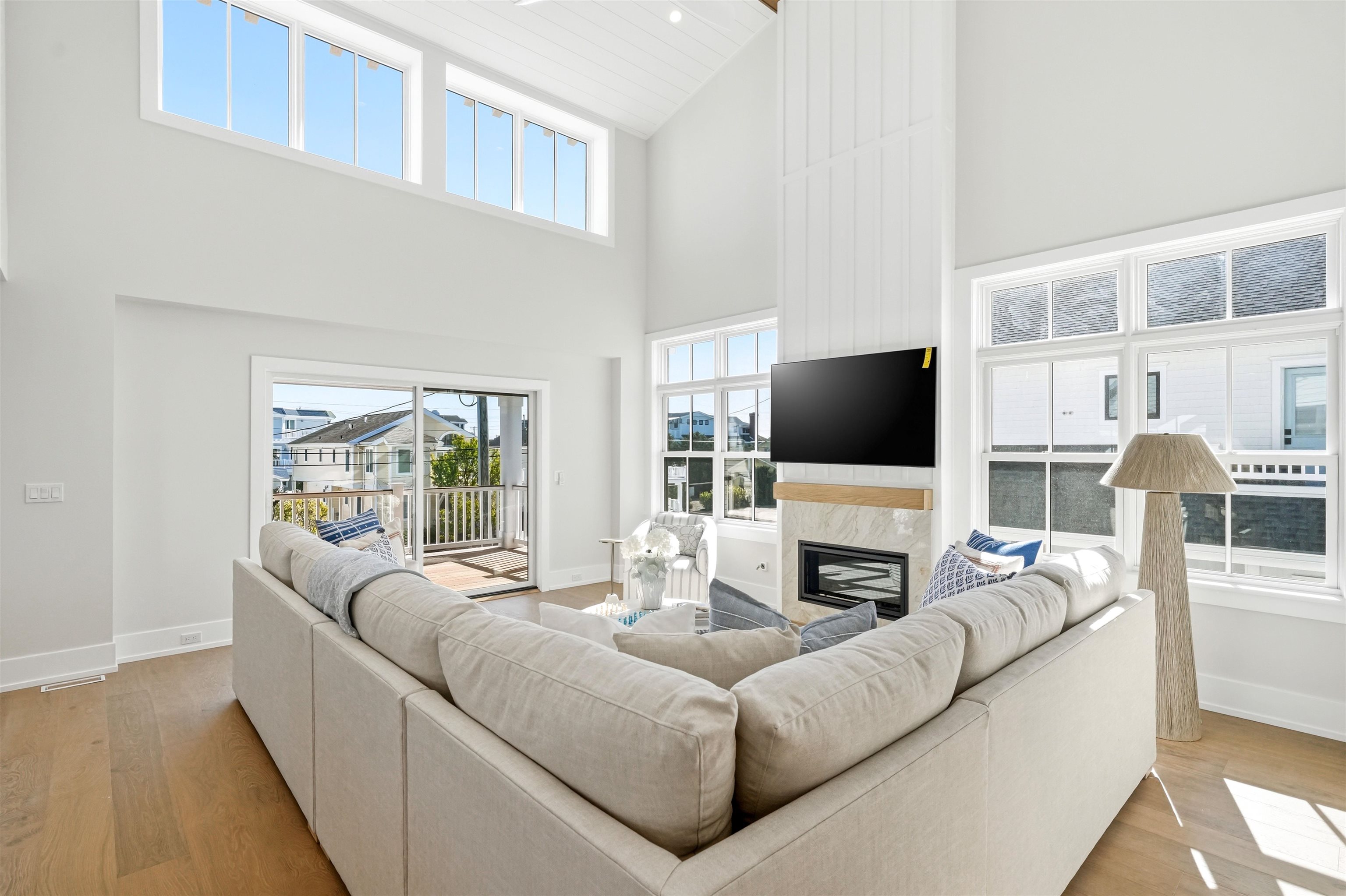 46 West 31st Avalon, NJ 08202 - Photo 19 of 50 a living room with fireplace furniture and a flat screen tv