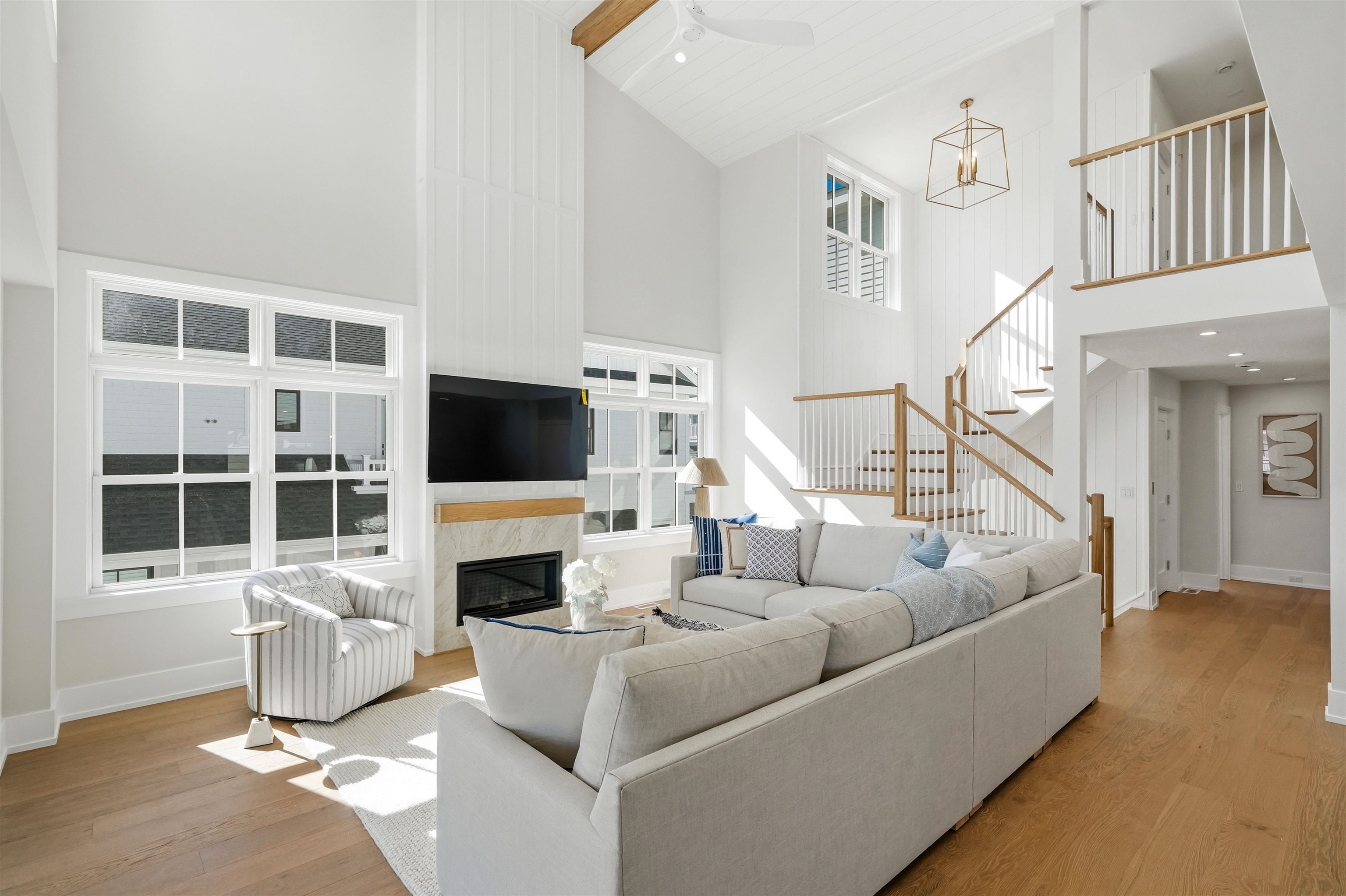 46 West 31st Avalon, NJ 08202 - Photo 20 of 50 a living room with furniture a flat screen tv and a fireplace