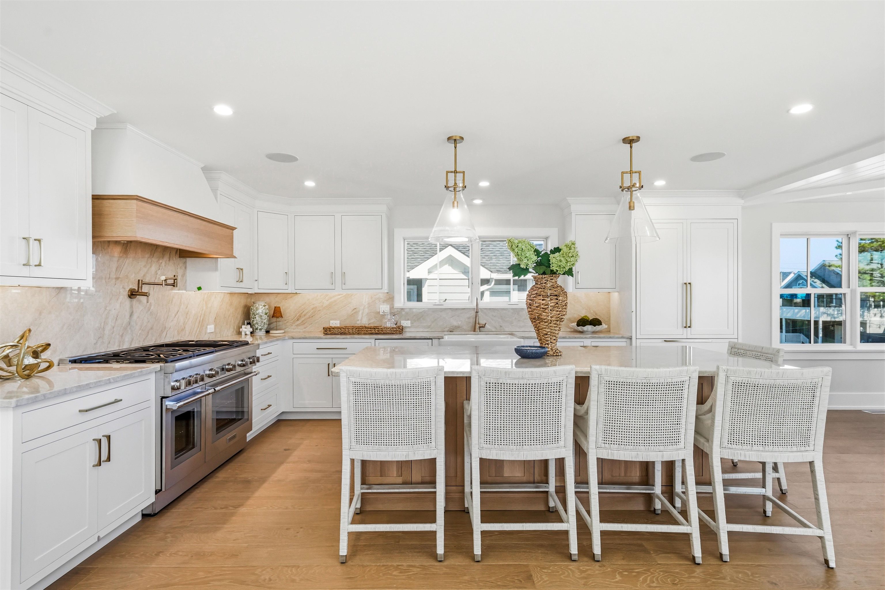 46 West 31st Avalon, NJ 08202 - Photo 24 of 50 a kitchen with a dining table chairs stainless steel appliances and cabinets