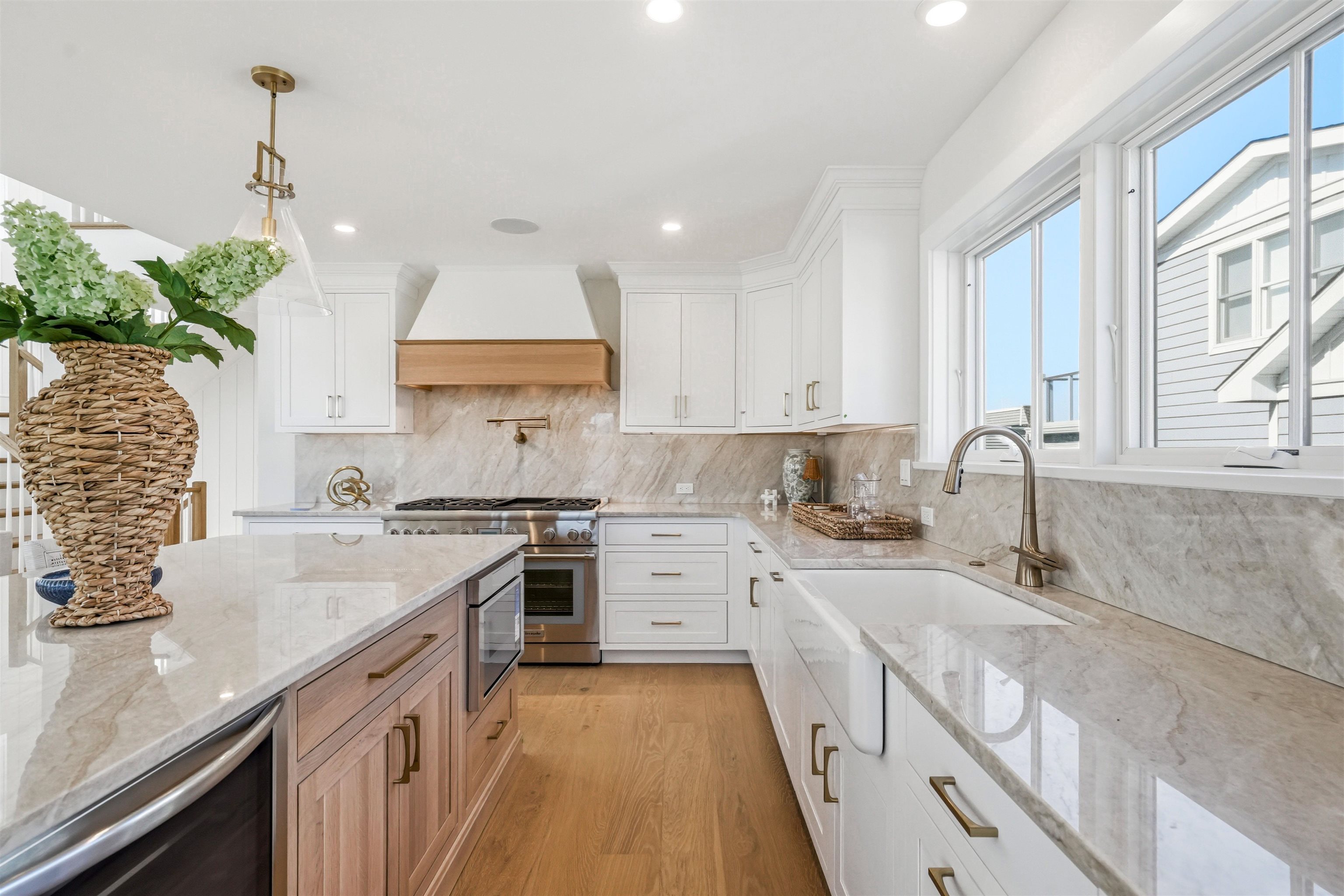46 West 31st Avalon, NJ 08202 - Photo 27 of 50 a kitchen with a sink stove and cabinets