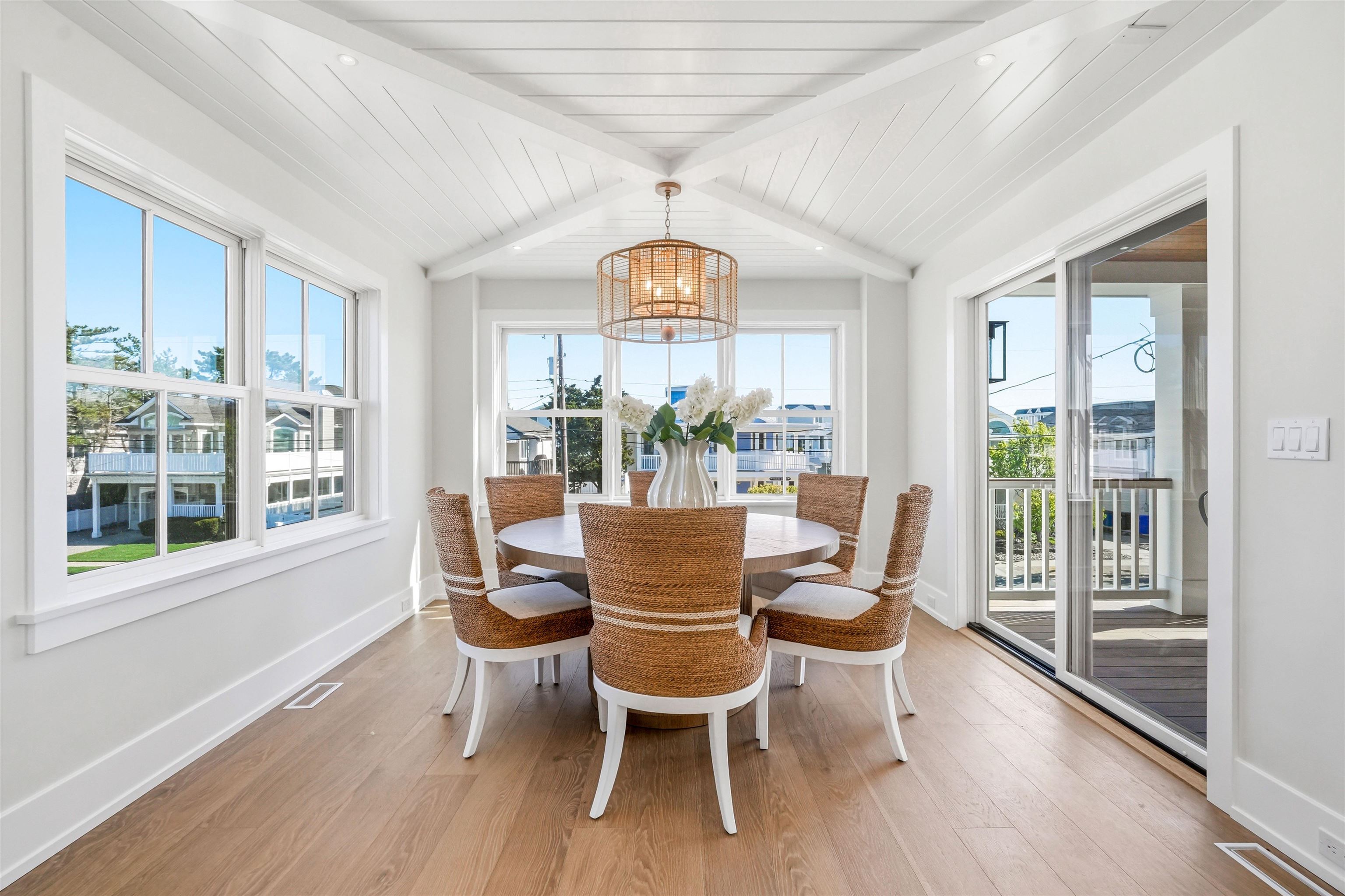 46 West 31st Avalon, NJ 08202 - Photo 29 of 50 a dining room with furniture a chandelier and wooden floor