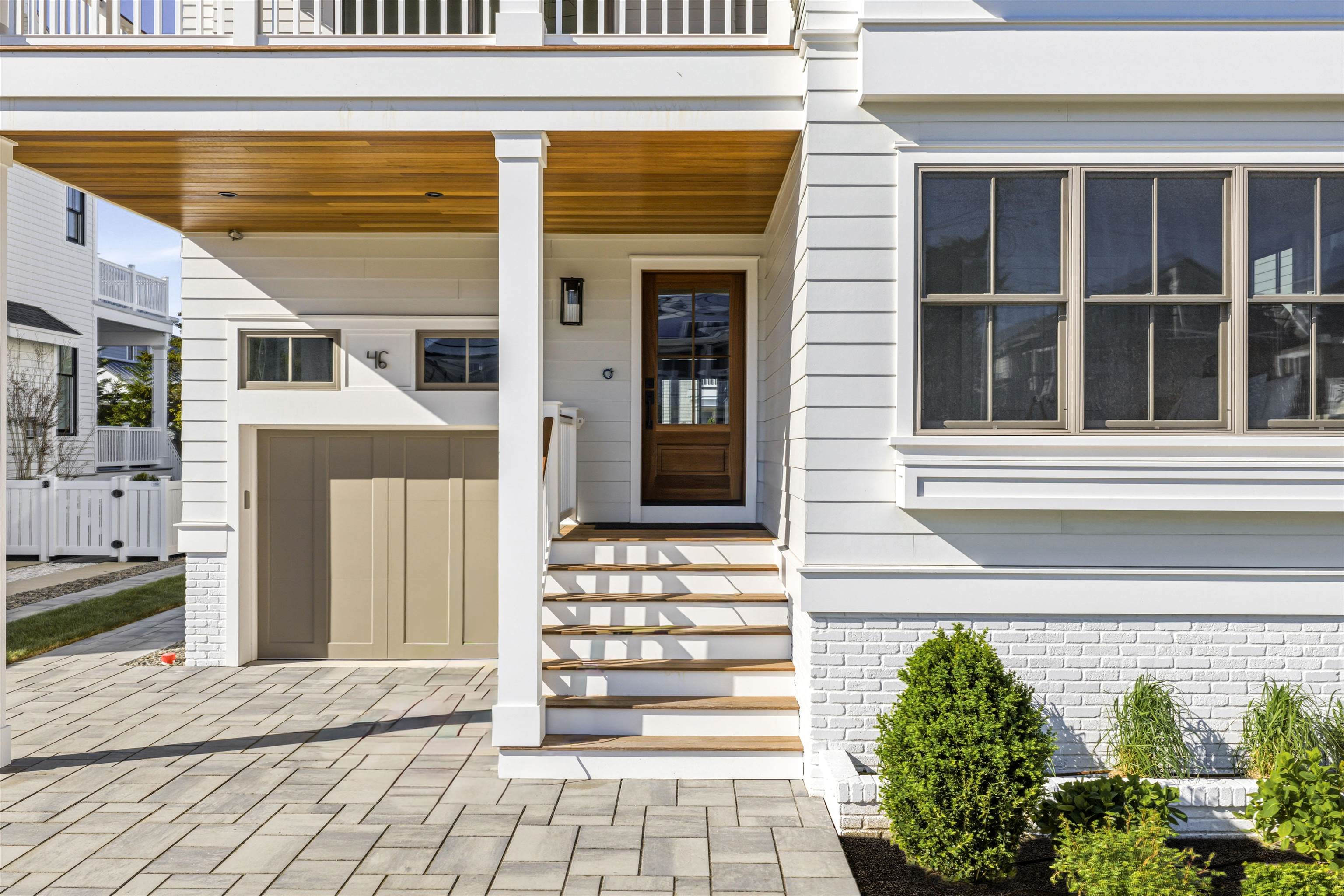 46 West 31st Avalon, NJ 08202 - Photo 3 of 50 a front view of a house with a garage