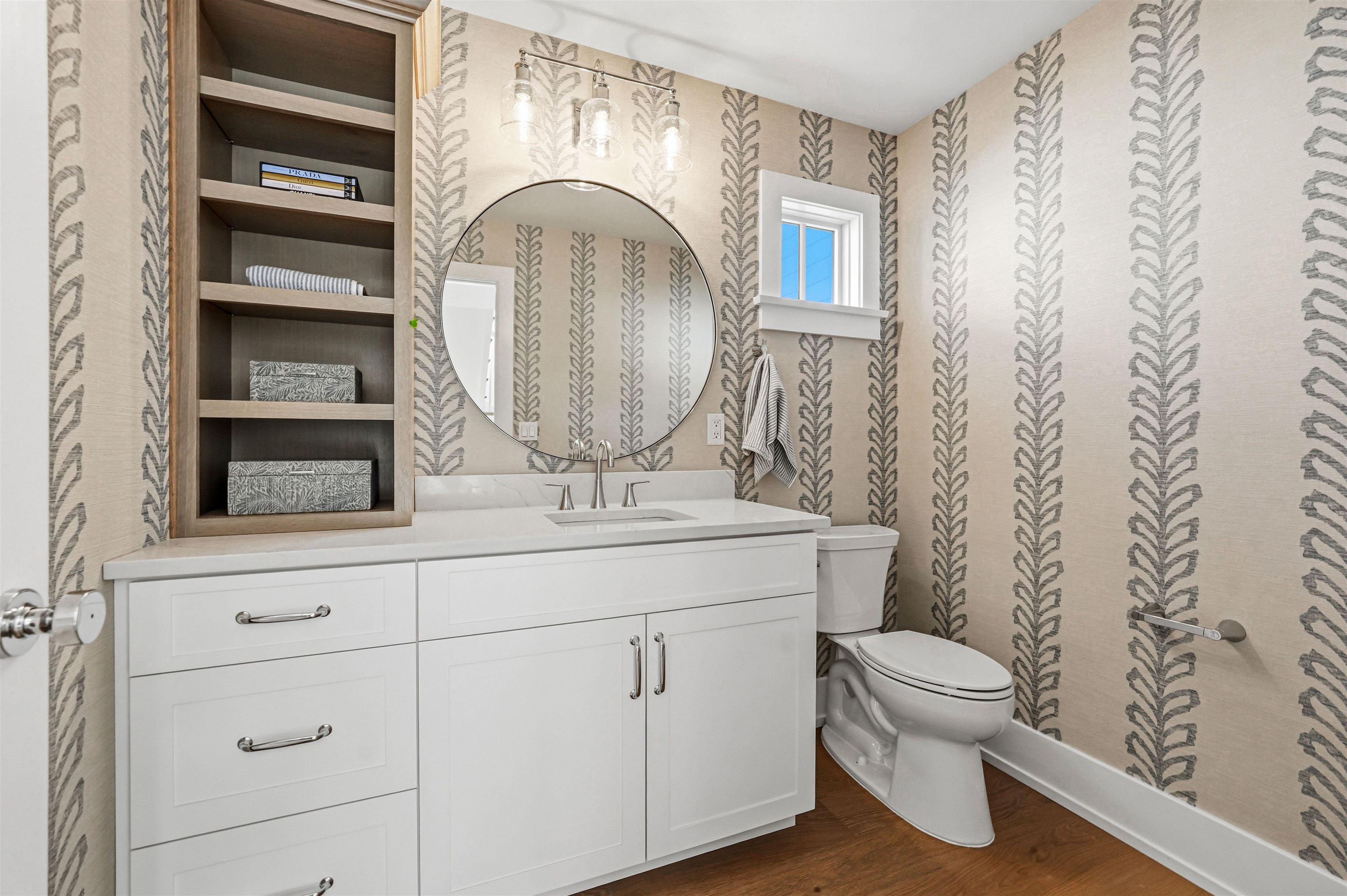46 West 31st Avalon, NJ 08202 - Photo 31 of 50 a bathroom with a toilet a sink and mirror