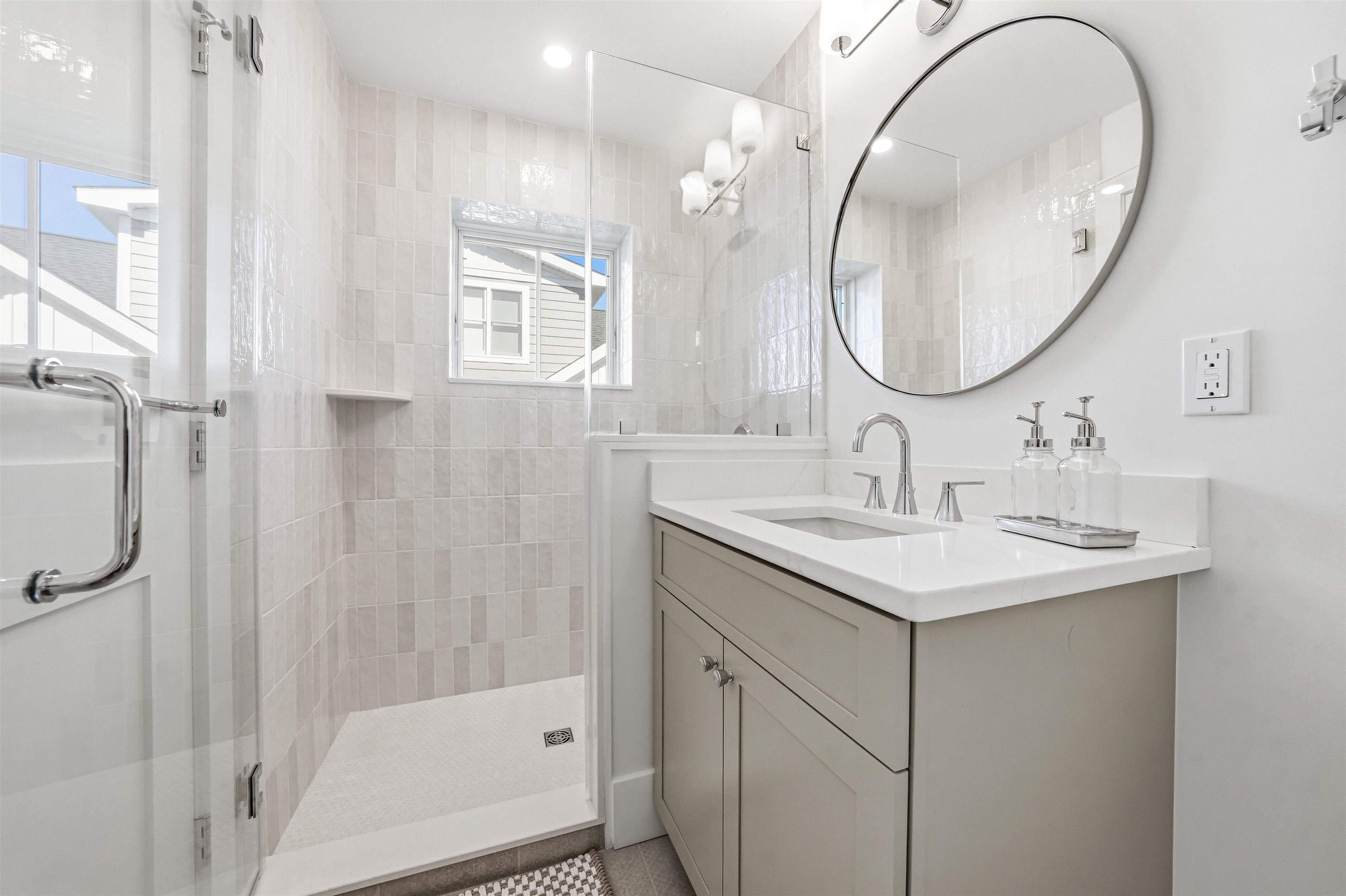 46 West 31st Avalon, NJ 08202 - Photo 33 of 50 a bathroom with a sink a mirror a vanity and a shower