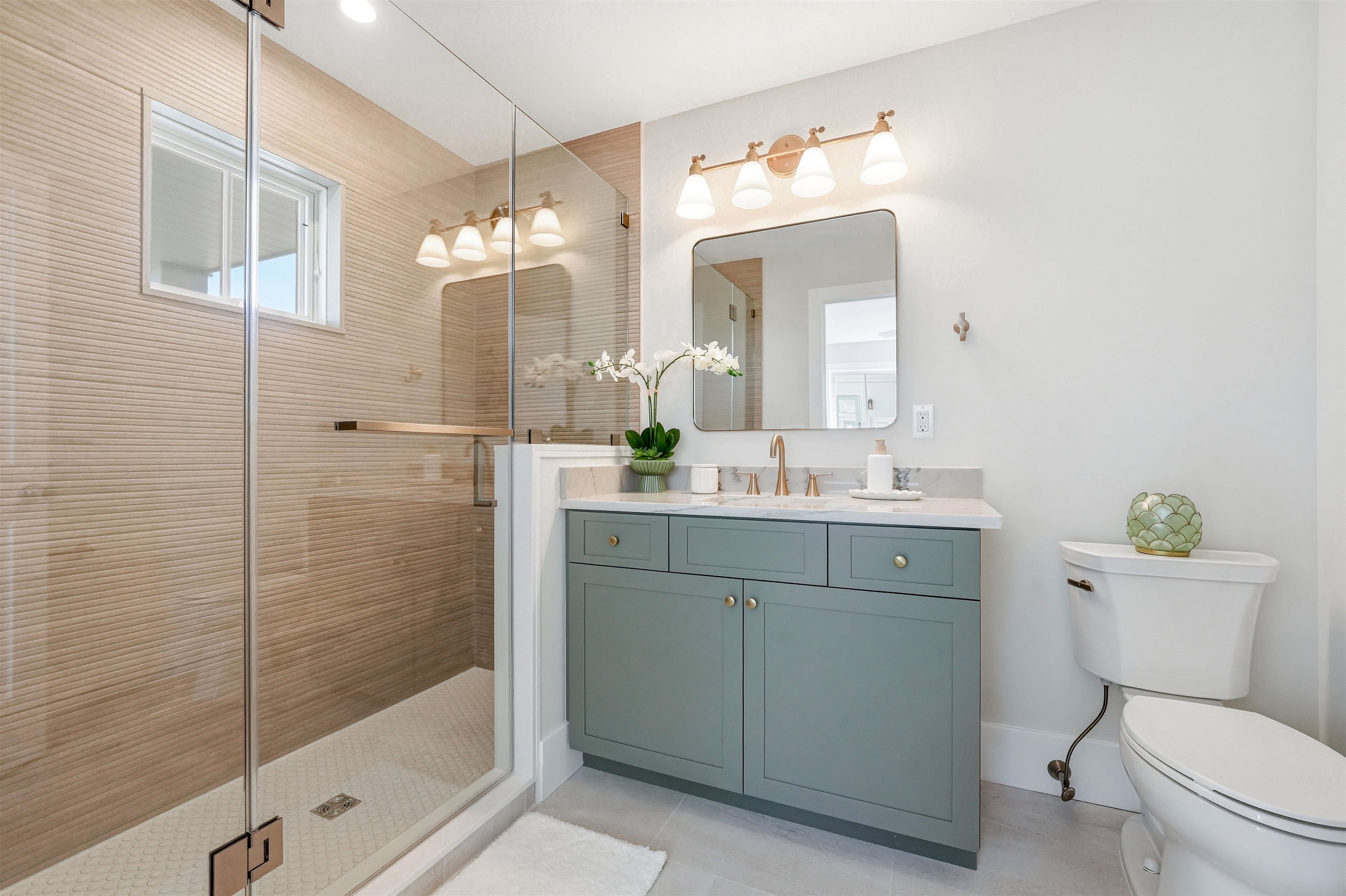 46 West 31st Avalon, NJ 08202 - Photo 36 of 50 a bathroom with a sink vanity mirror and toilet