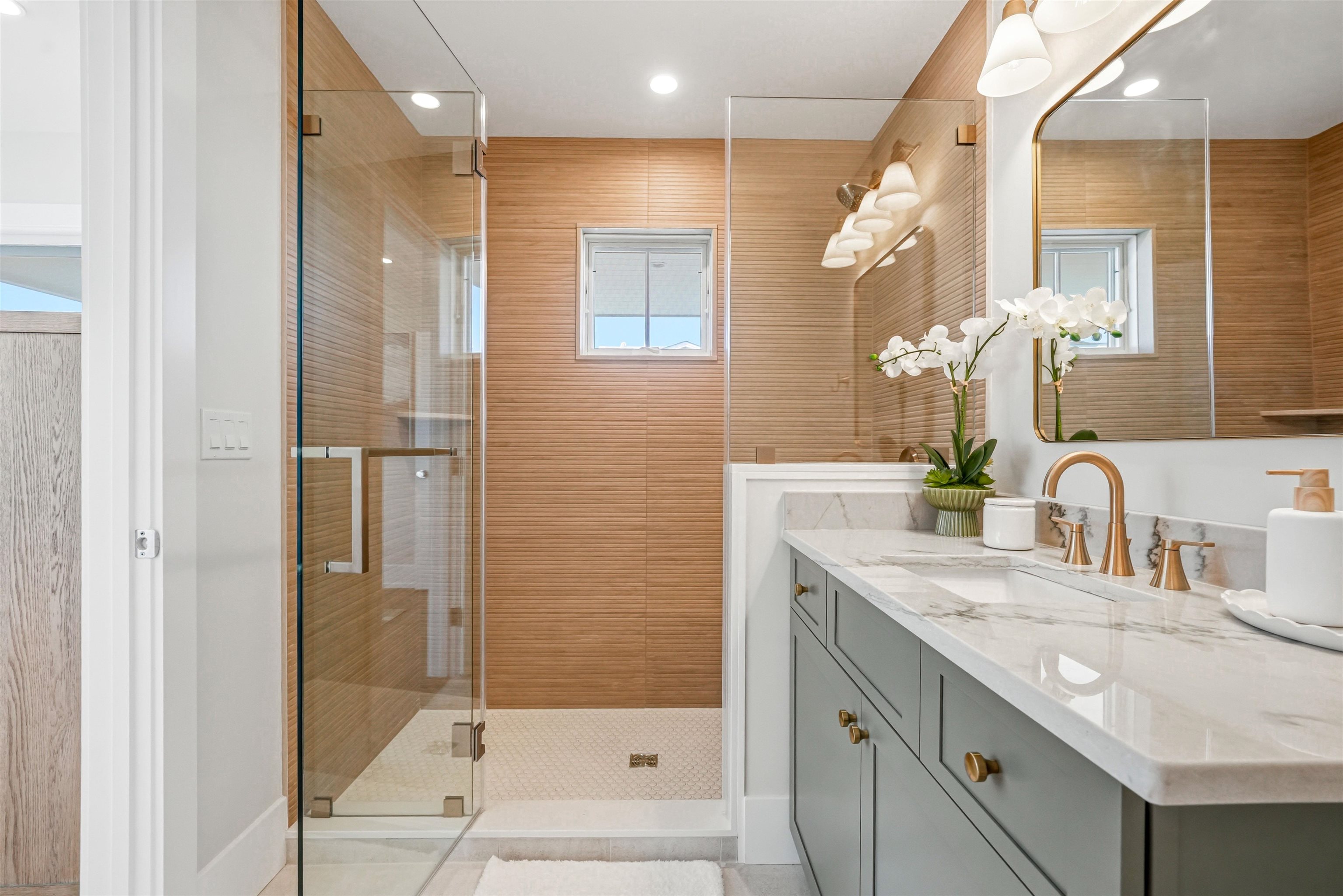 46 West 31st Avalon, NJ 08202 - Photo 37 of 50 a bathroom with a granite countertop sink mirror and shower