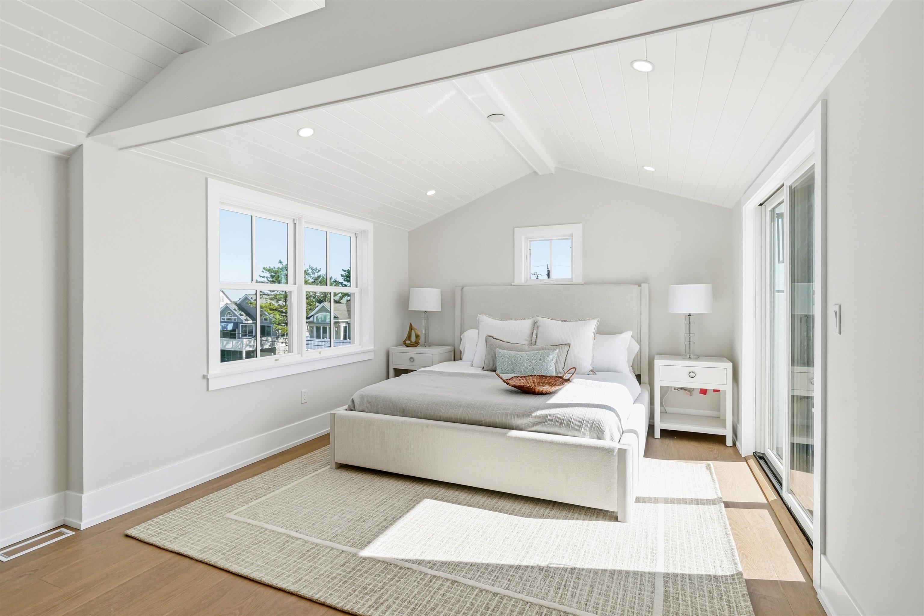 46 West 31st Avalon, NJ 08202 - Photo 41 of 50 a bedroom with a large bed and a window