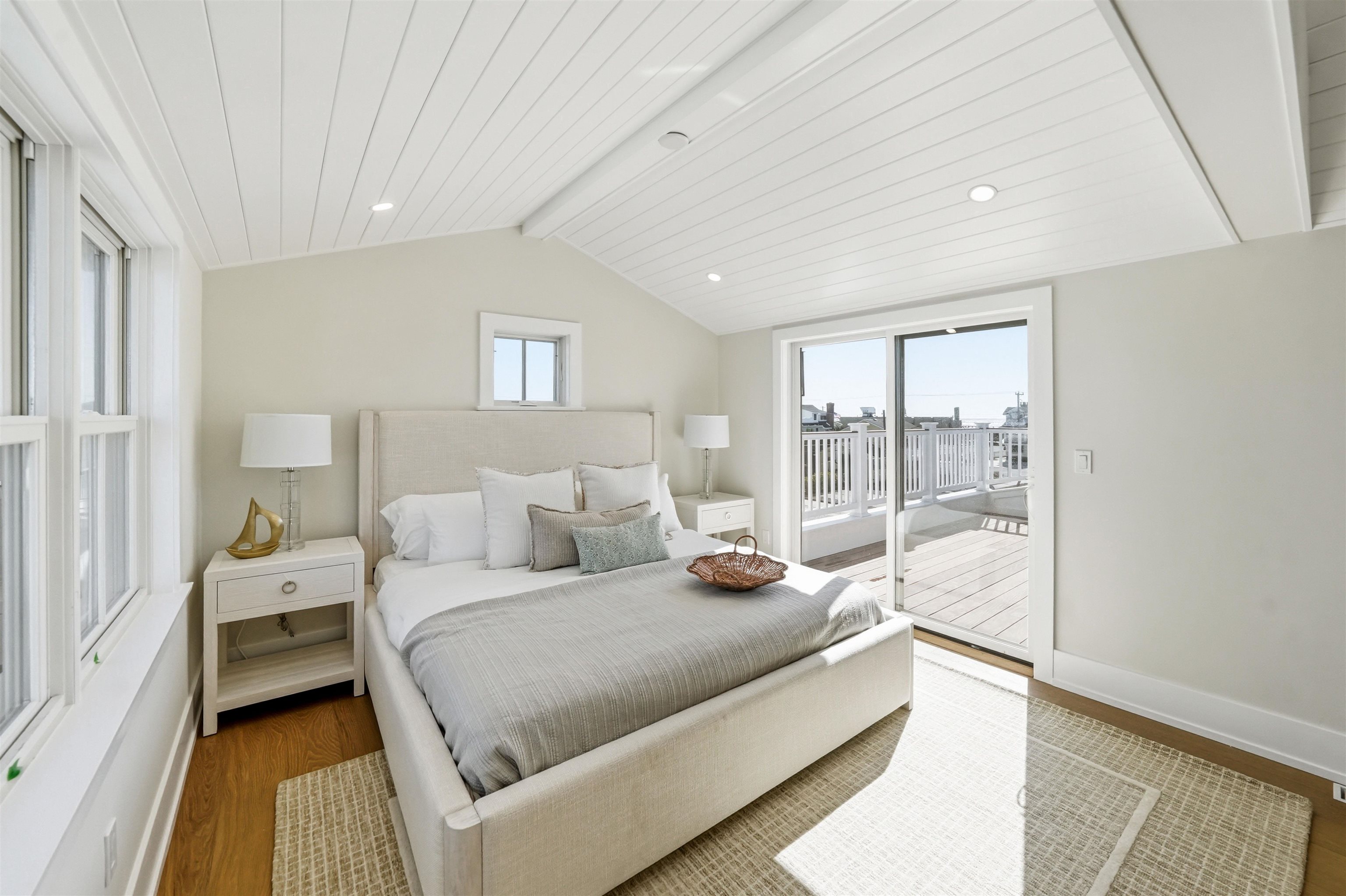 46 West 31st Avalon, NJ 08202 - Photo 42 of 50 a bedroom with a bed and a large window