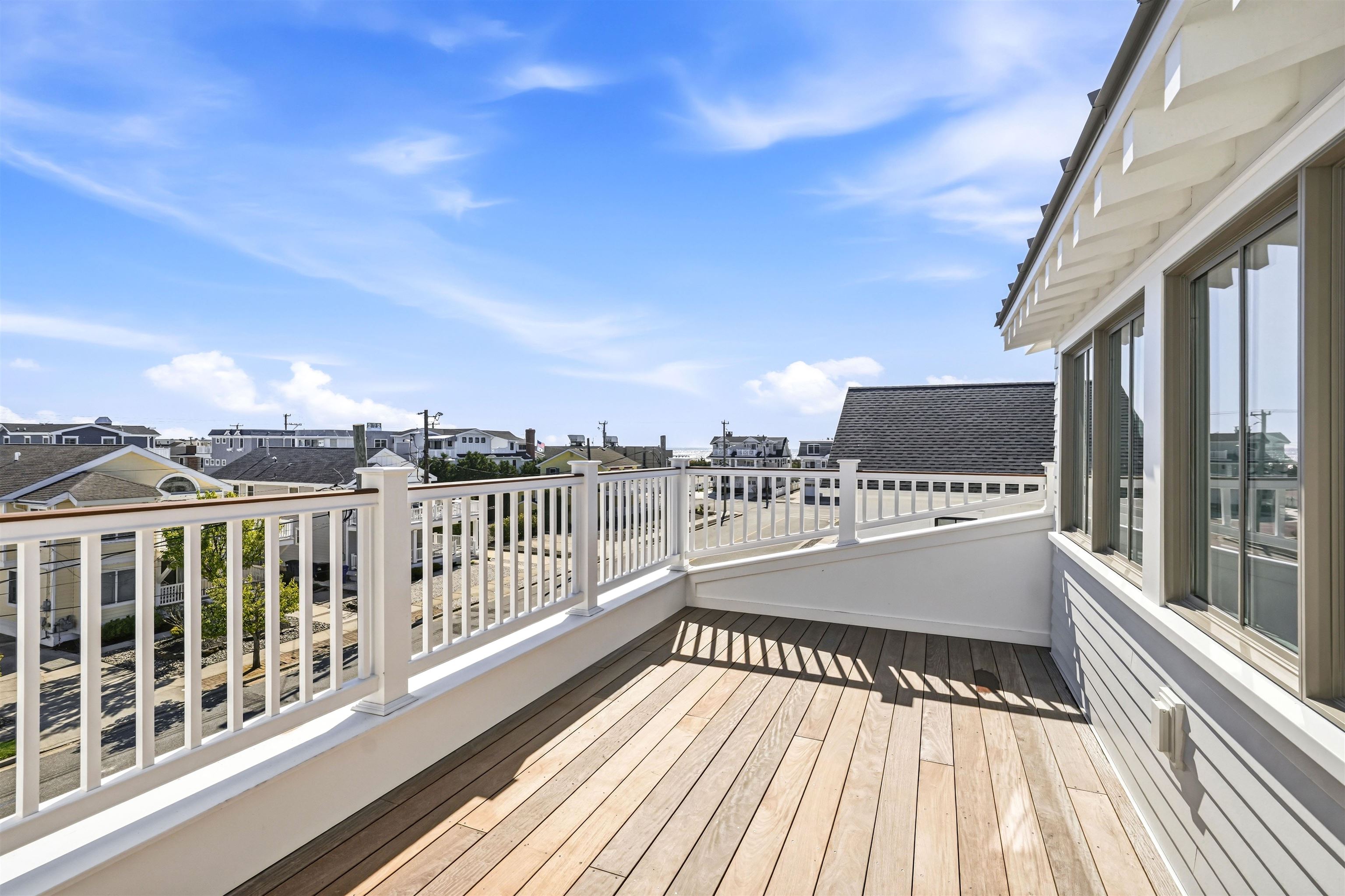 46 West 31st Avalon, NJ 08202 - Photo 43 of 50 a view of balcony with a large window and wooden floor
