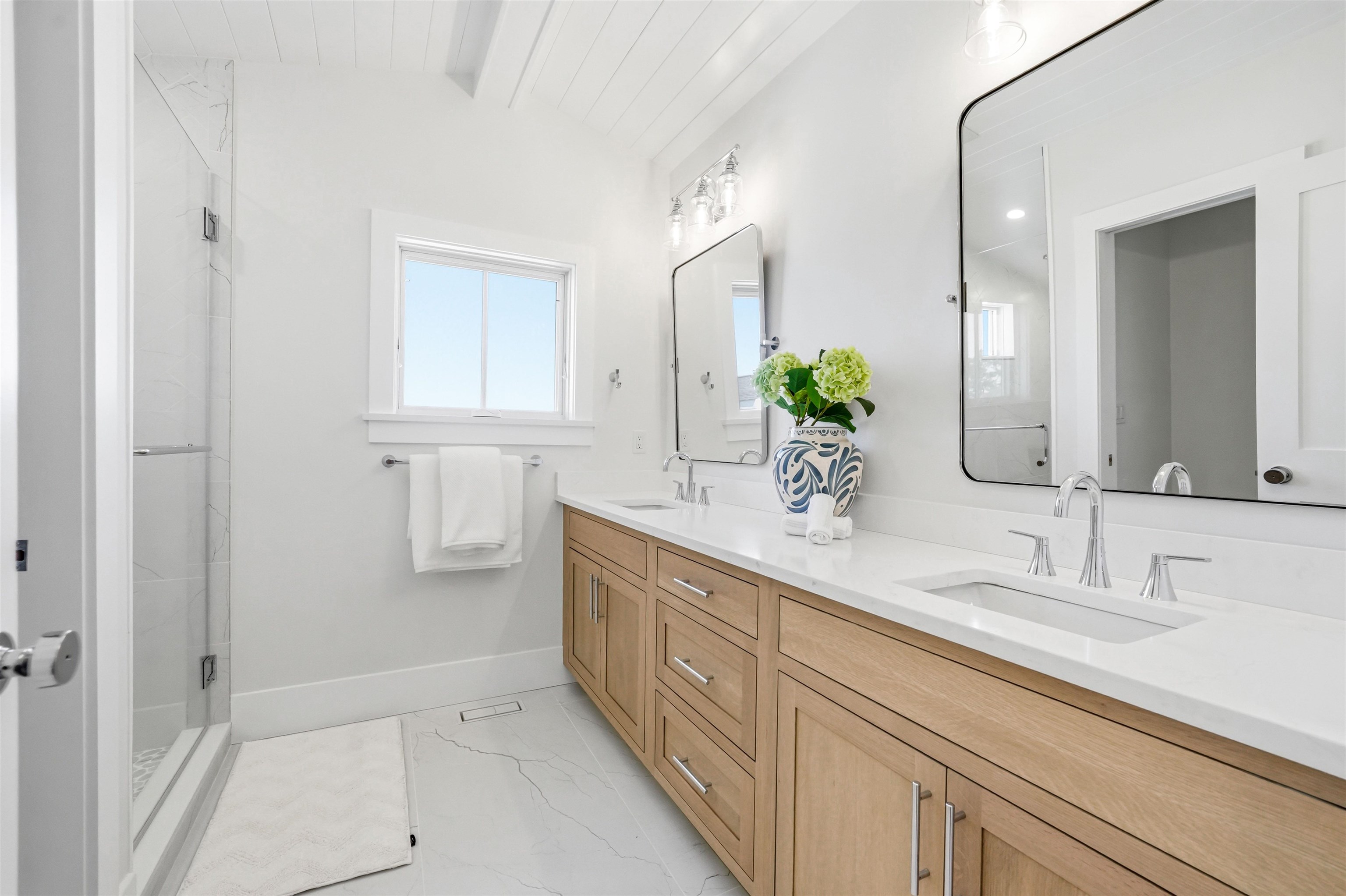 46 West 31st Avalon, NJ 08202 - Photo 44 of 50 a bathroom with a double vanity sink and a mirror