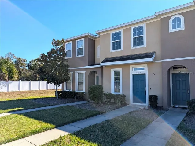 a view of a house with a yard