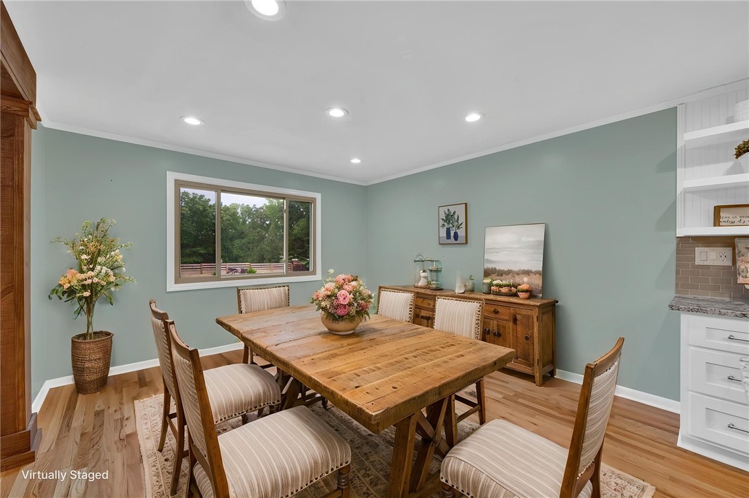 433 Latham Road Easley, SC 29640 - Photo 26 of 50 A window frames nature's beauty in this charming dining space with hardwood floors.