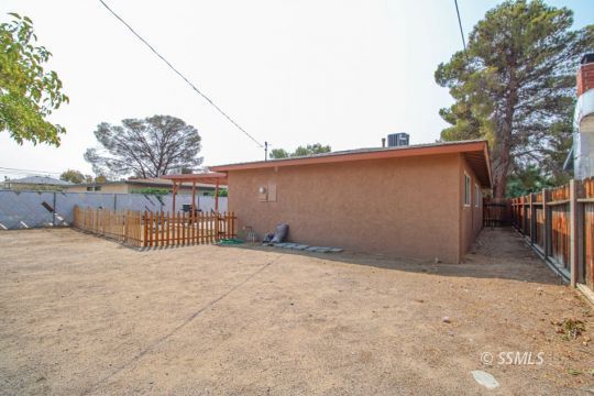708 West Perdew Avenue Ridgecrest, CA 93555 - Photo 35 of 37 a view of a house with wooden fence