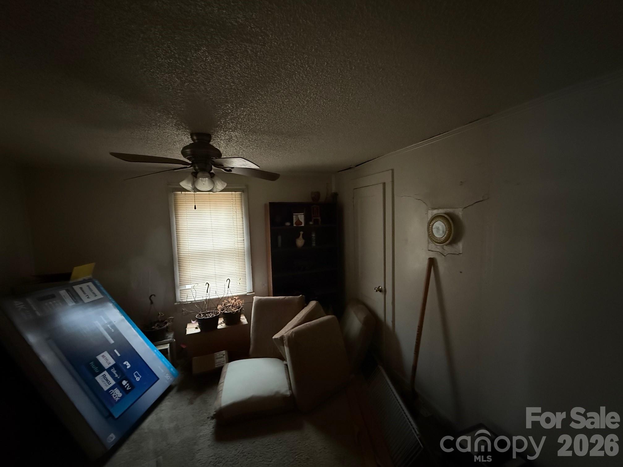 624 Blue Street Troy, NC 27371 - Photo 12 of 14 a living room with furniture and a window