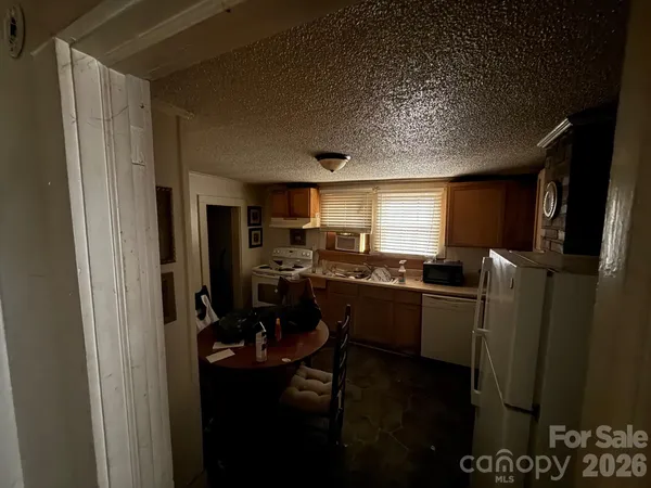 a room with furniture window and kitchen view