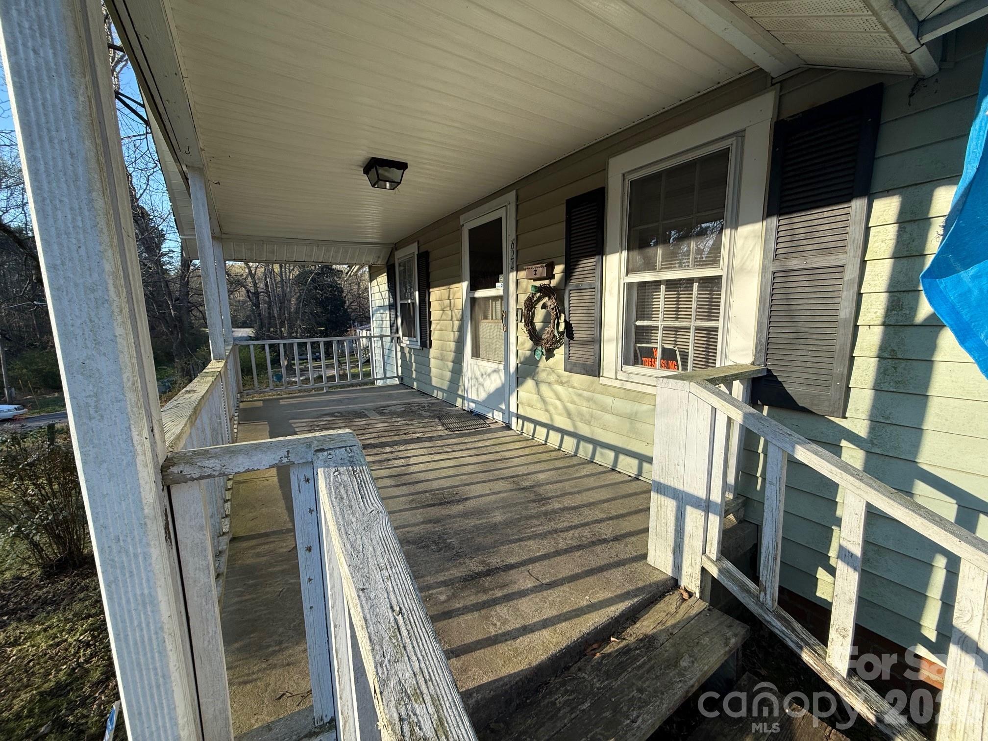624 Blue Street Troy, NC 27371 - Photo 2 of 14 a view of a livingroom with wooden floor and furniture